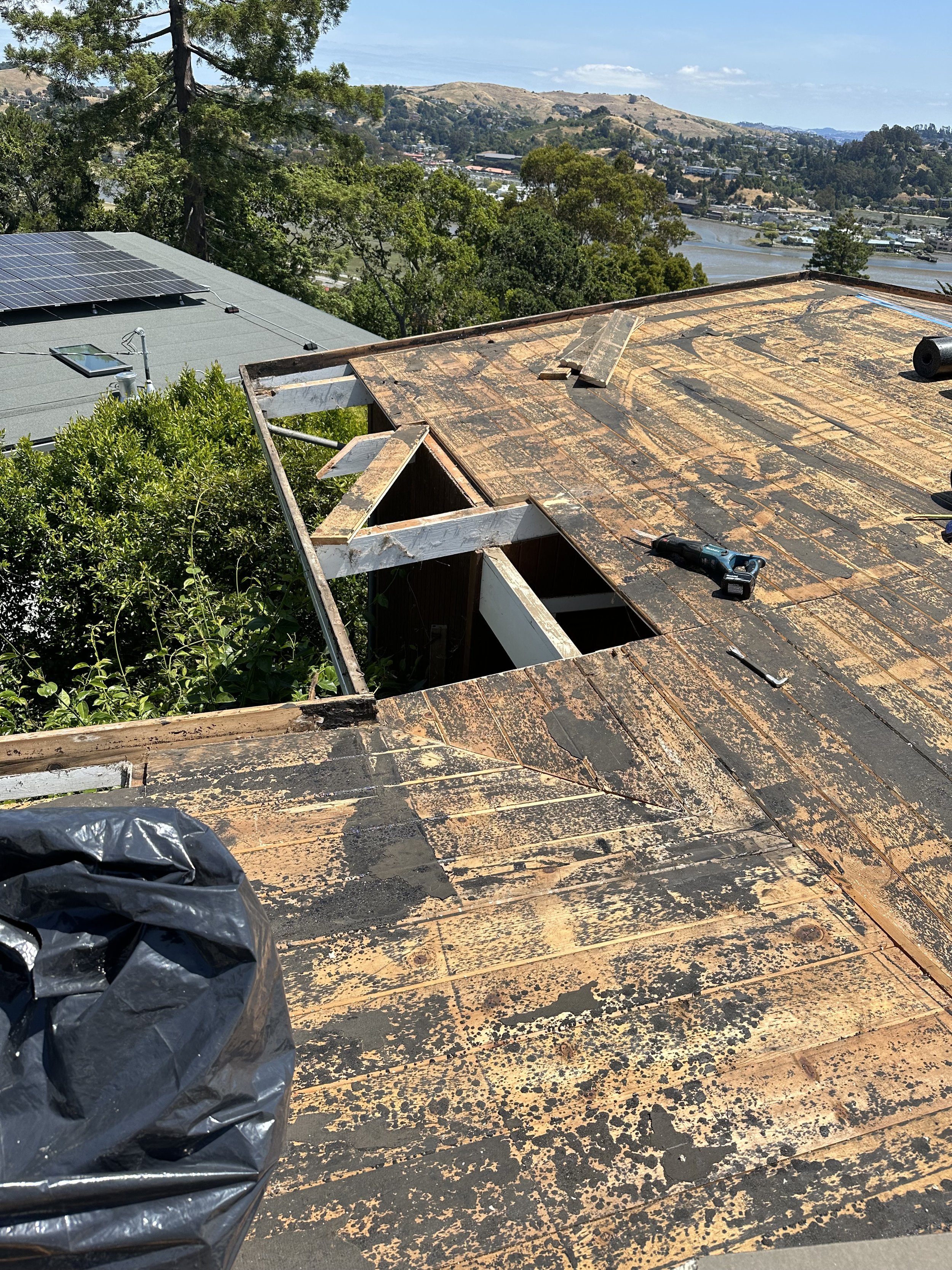 Low-slope roof tear-off and deck repair