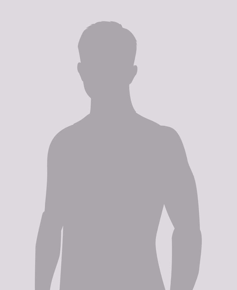 Silhouette of a person with short hair, facing forward, against a light background.