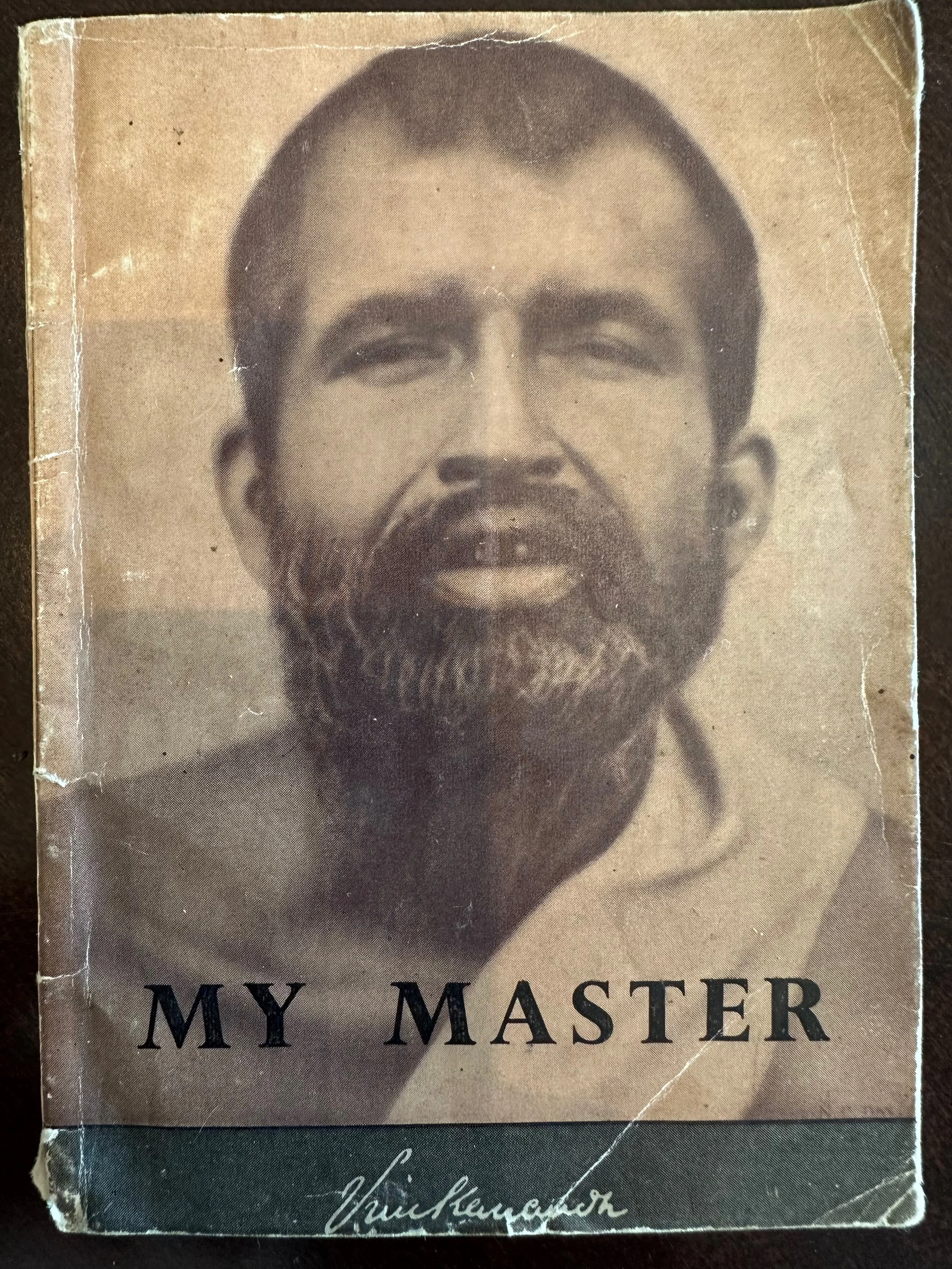 A vintage black and white photo of a man with a beard and mustache, smiling, with the words "MY MASTER" printed below.