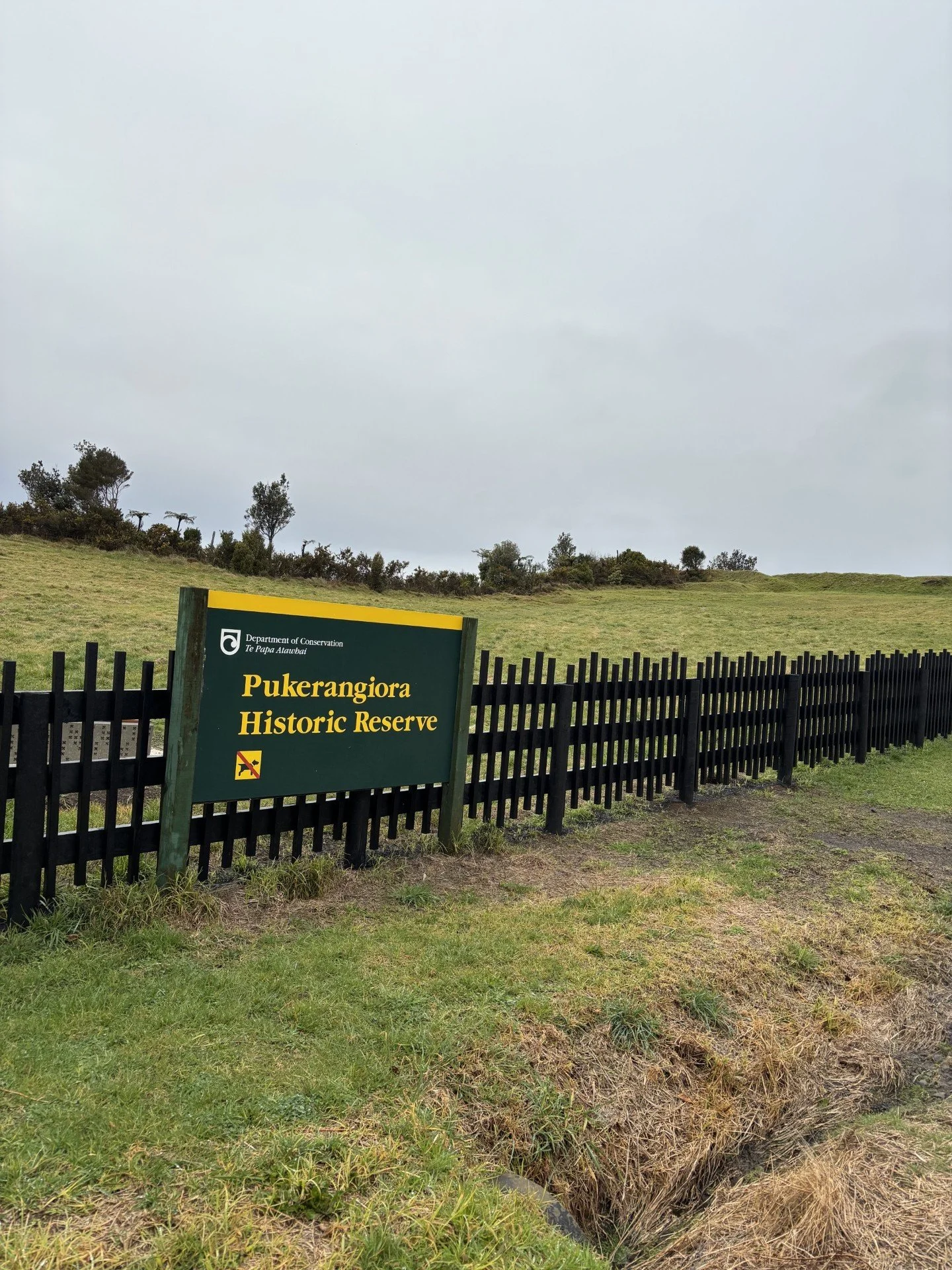 Fence with a DOC sign