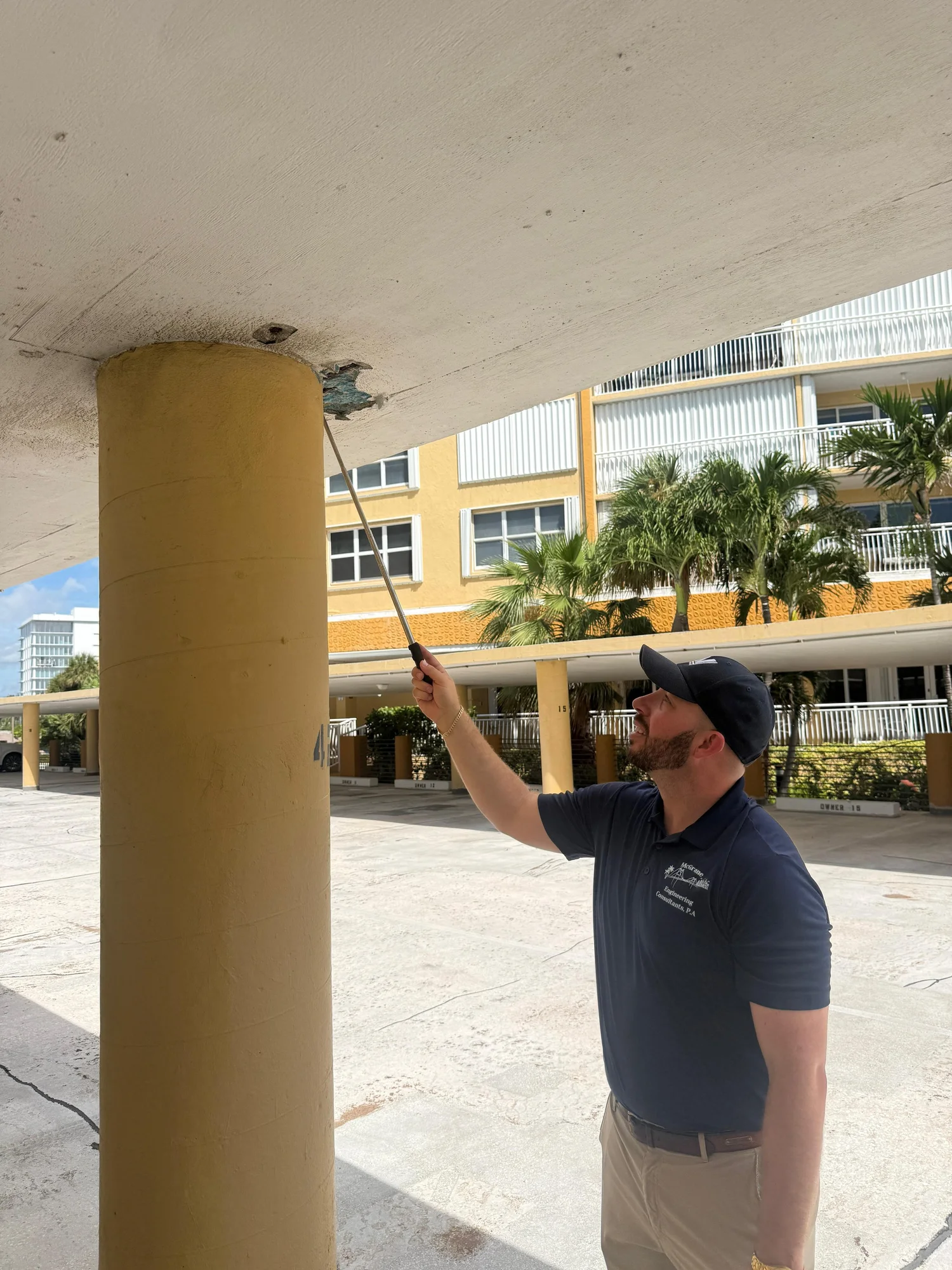Colin McGrane inspecting the underside of a concrete slab