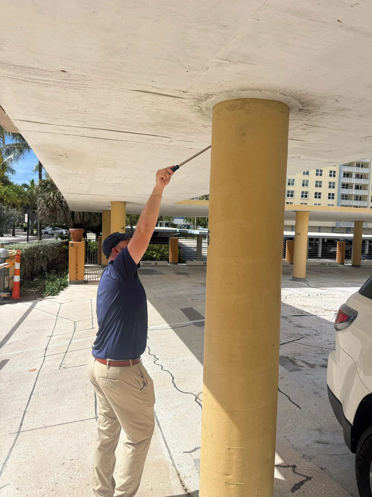 Colin McGrane inspecting a concrete slab
