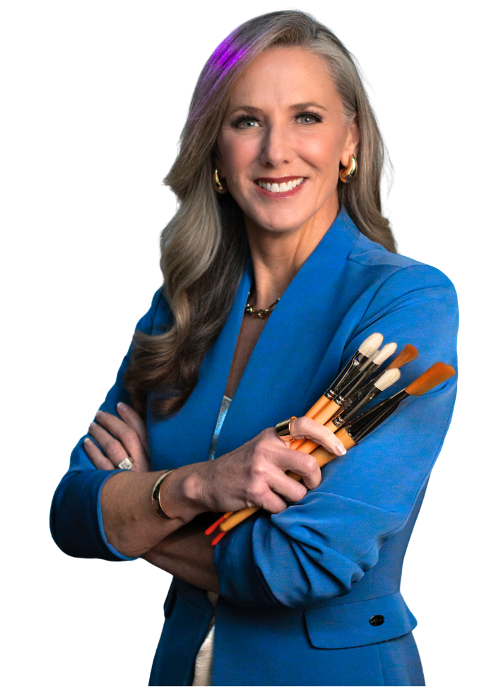Heather Hodges wearing a blue top, creativity keynote speaker and a live speed-painter holding a bunch of paintbrushes.