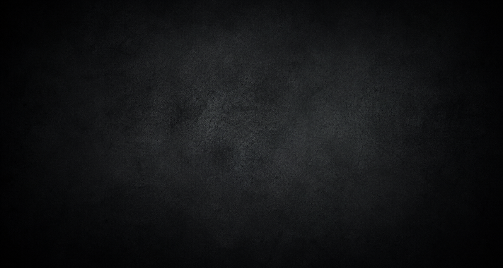 A black textured surface, evenly illuminated with a subtle gradient.