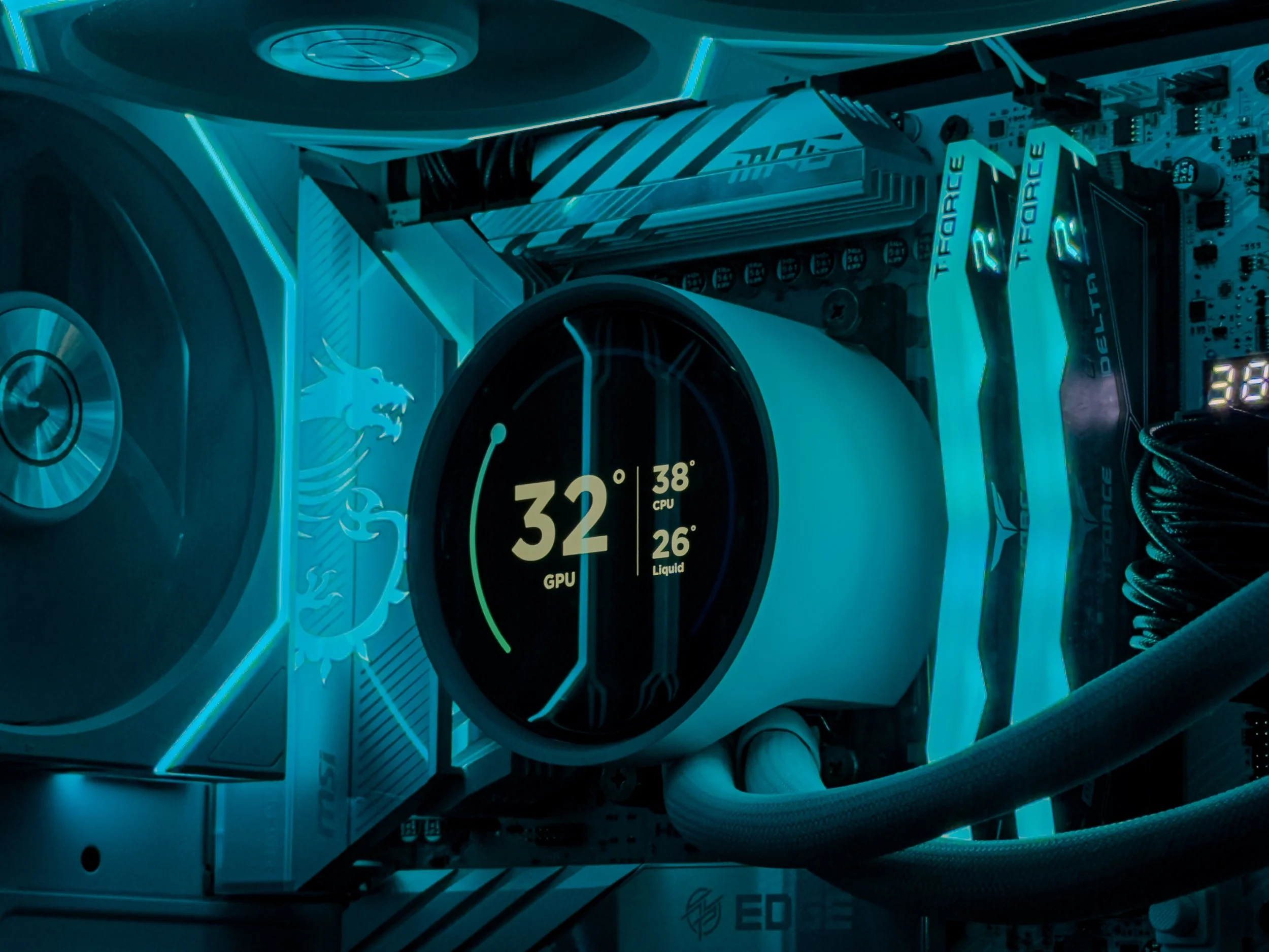 Close-up of a high-tech computer graphics card with neon blue accents, visible memory modules, and digital display showing temperature readings.
