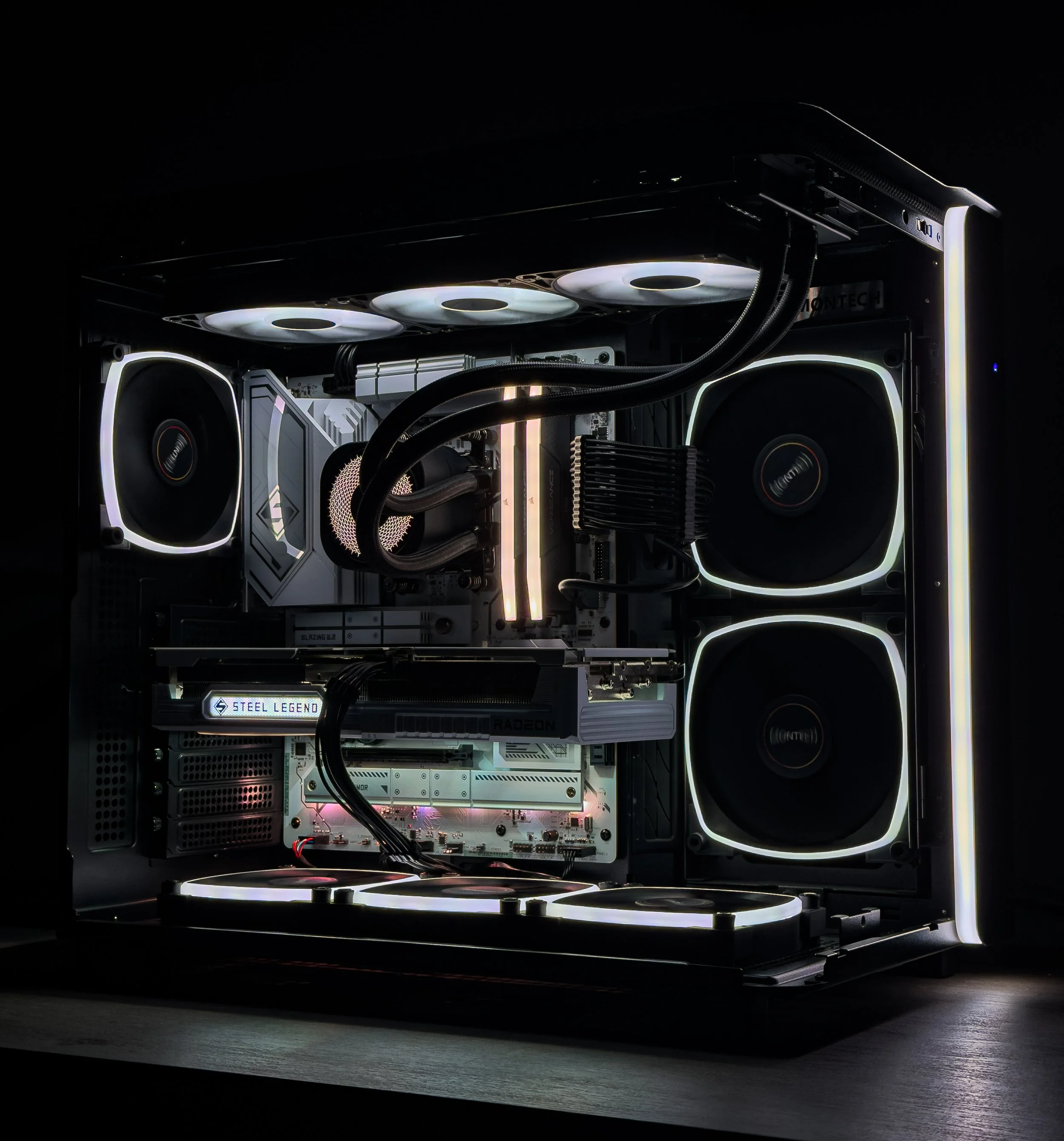 A computer custom-built with high-end components, including RGB-lit fans, cooling system, and graphics card, in a dark environment.