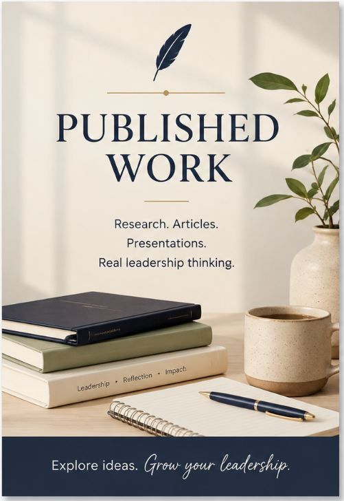 A promotional sign with a feather icon, displaying the text "Published Work" and phrases about research, articles, presentations, and leadership, next to a notebook, a pen, a coffee mug, and a potted plant.