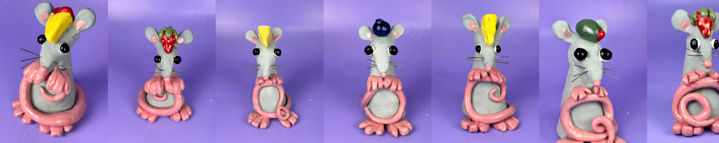 A series of colorful mouse figurines with different colored hats arranged in a row against a purple background.
