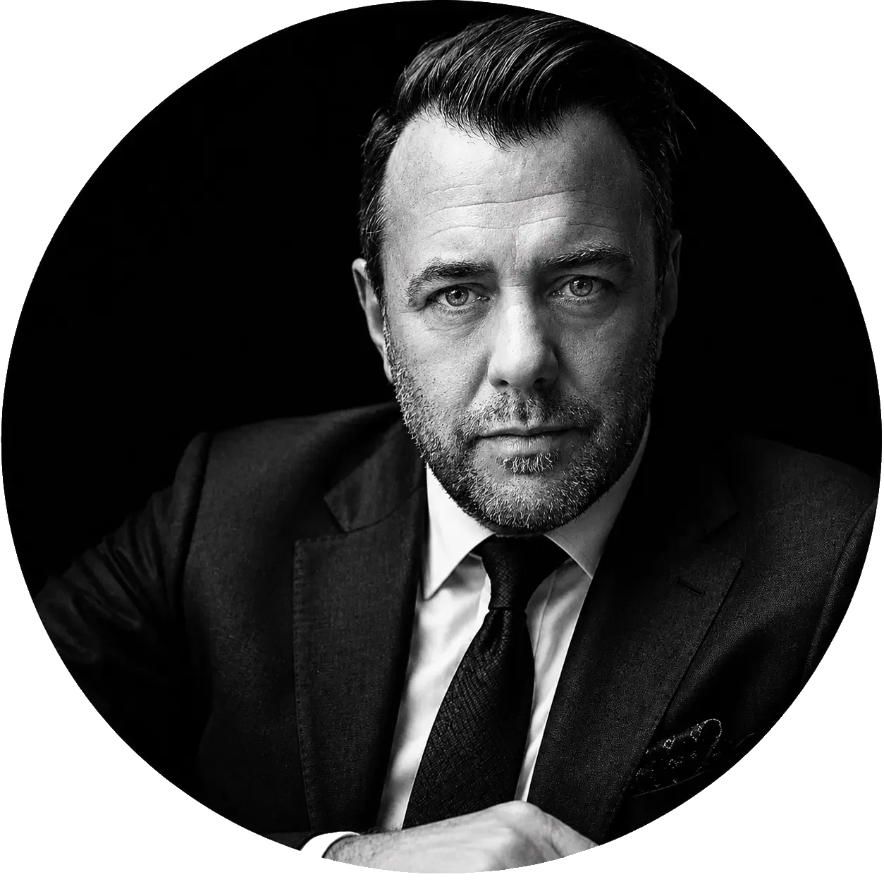 David Kavanagh, founder of THNK, black-and-white portrait in a suit