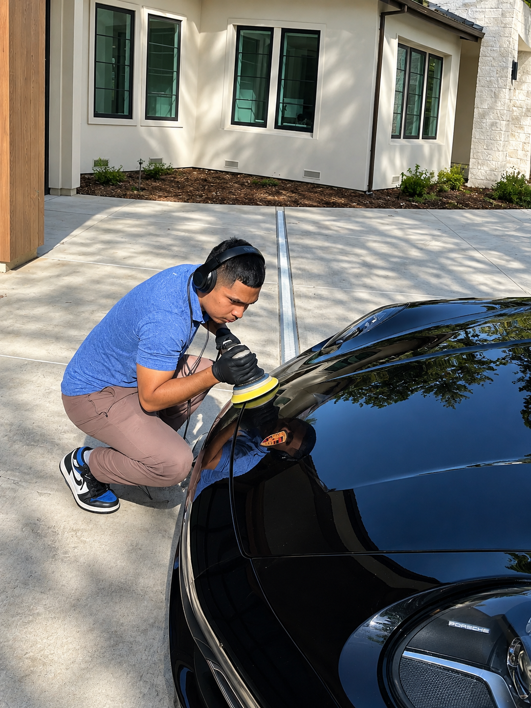 J's Mobile Detailing technician hand-polishing a vehicle in a Roseville, CA driveway.