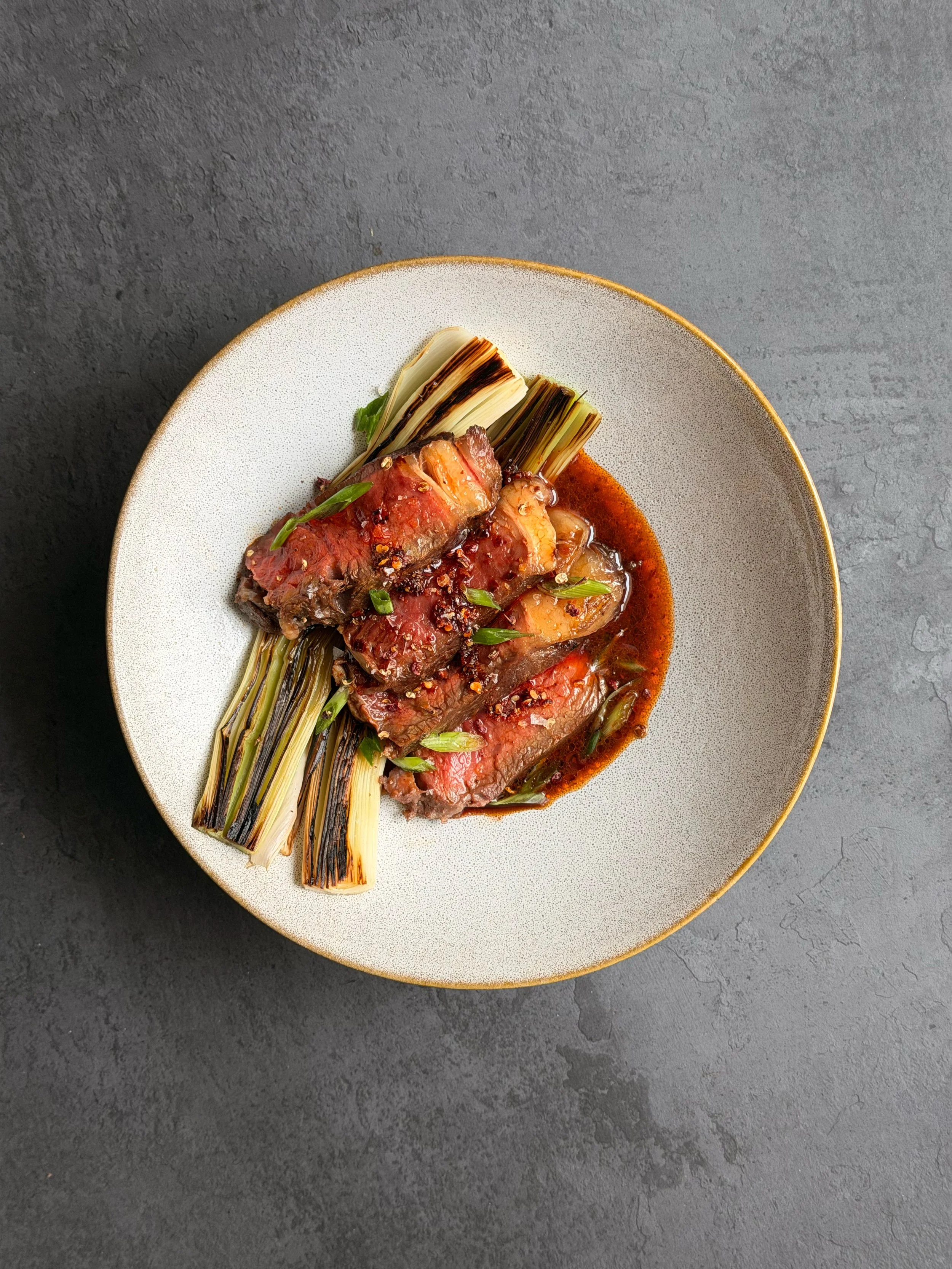 Sichuan Ribeye with Charred Leeks & Chilli-Oil Beef Jus recipe