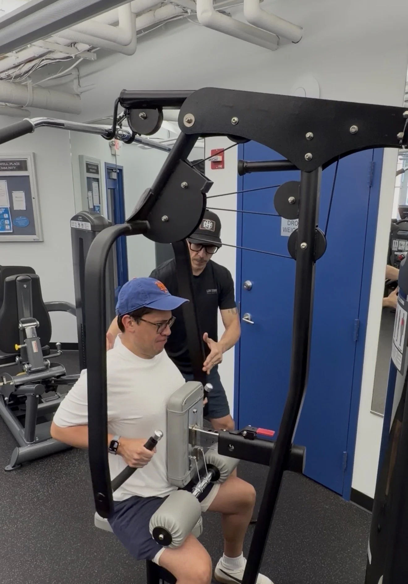 Derek Hubbard providing hands-on personal training and exercise coaching
