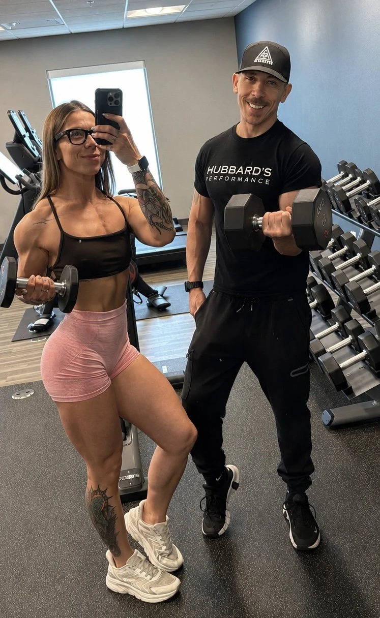 Derek and Leticia Hubbard of Hubbard Performance training together in a residential fitness center