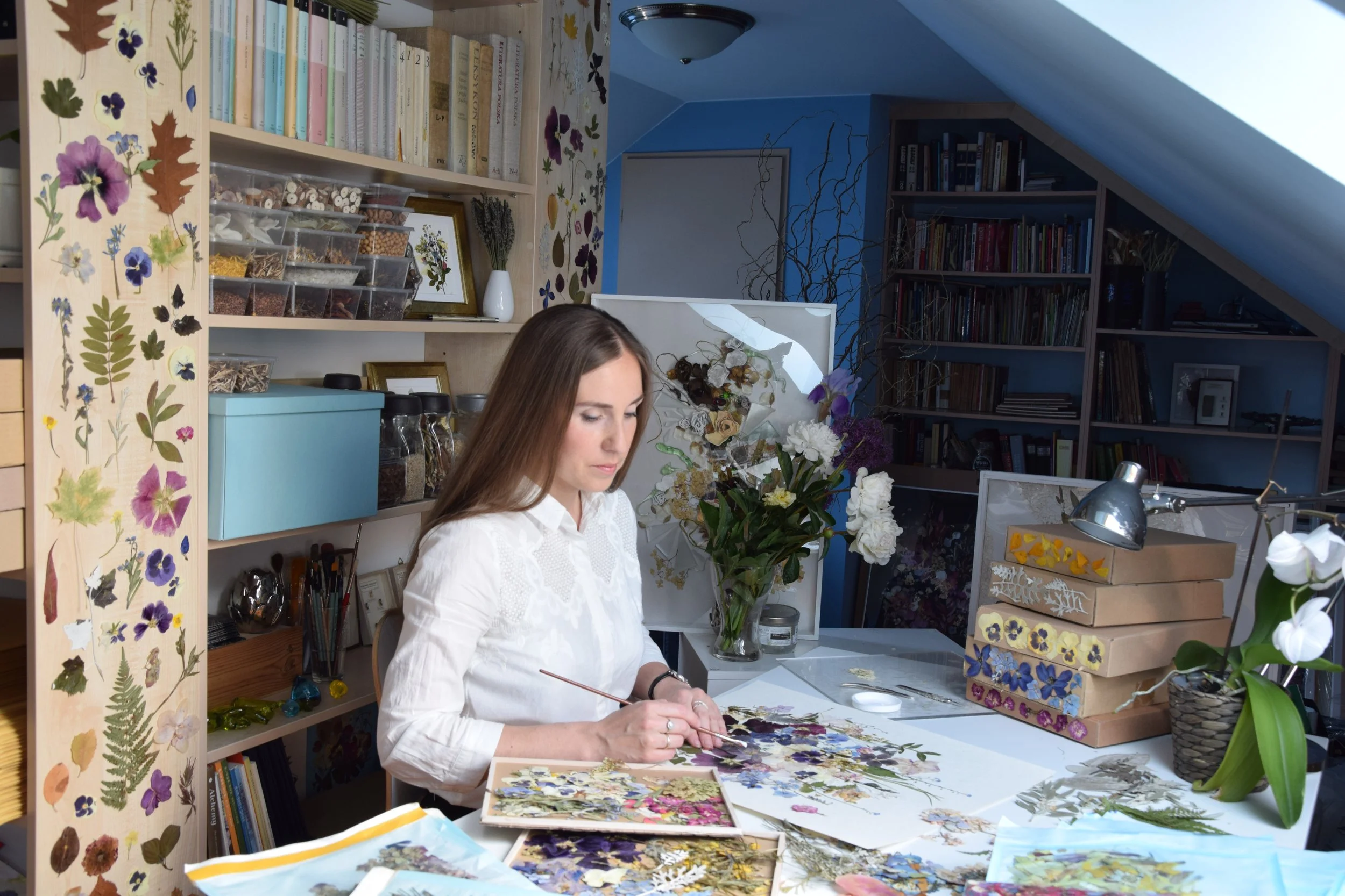 Anastasia Kovaleva working with dried flowers in her studio