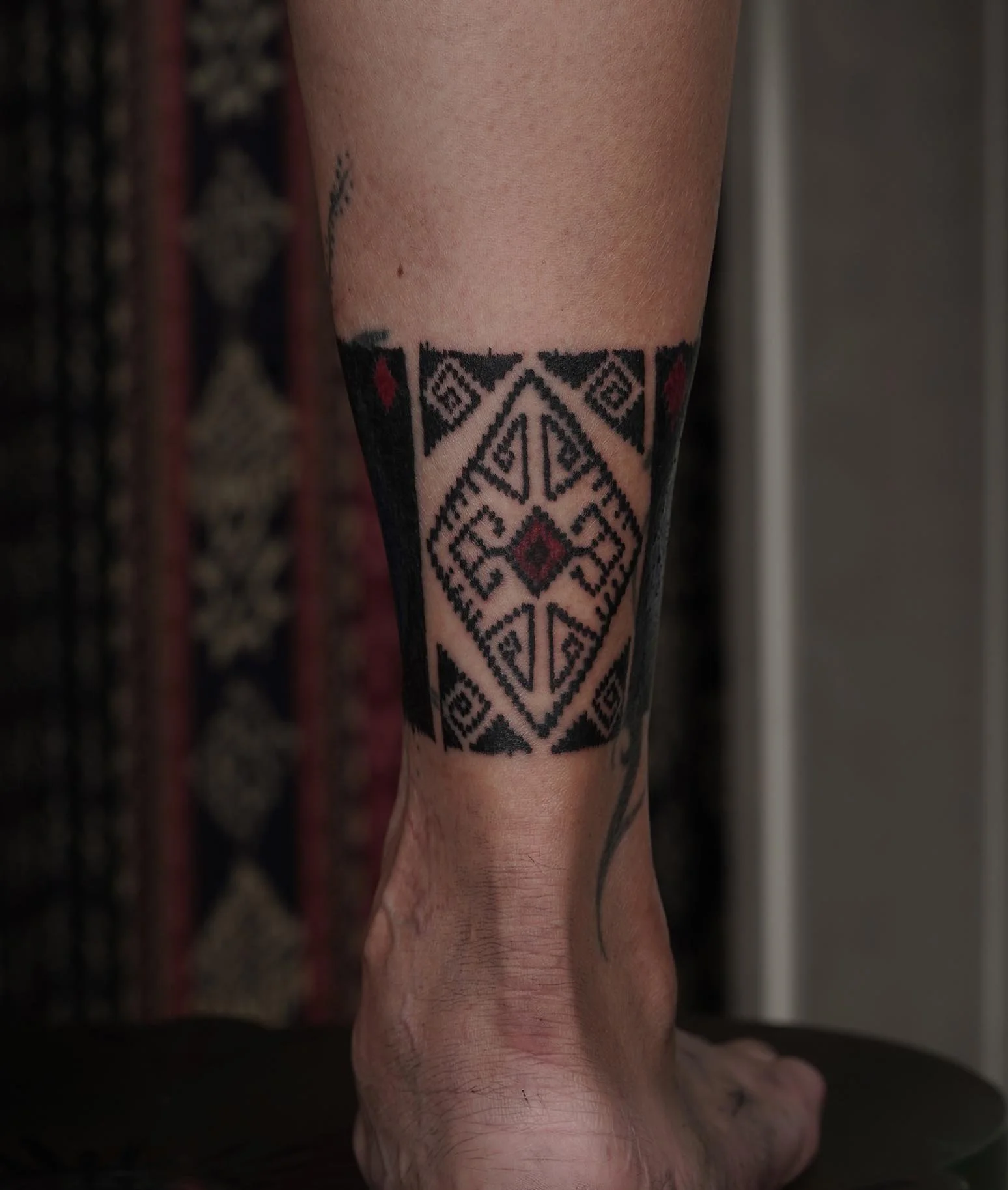ornamental ankle band tattoo bali
