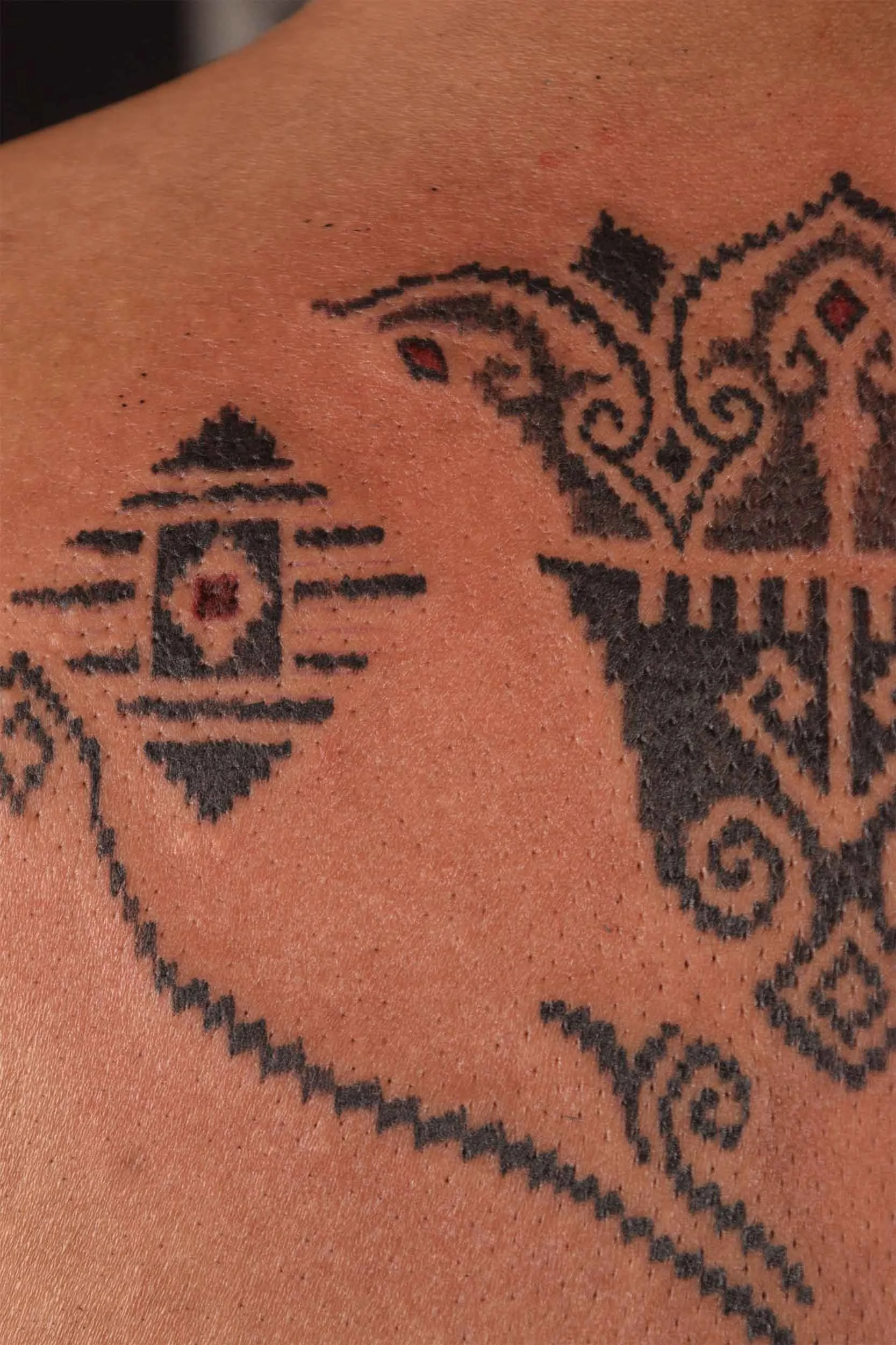 ornamental floral tulip tattoo inspired by tenun motif
