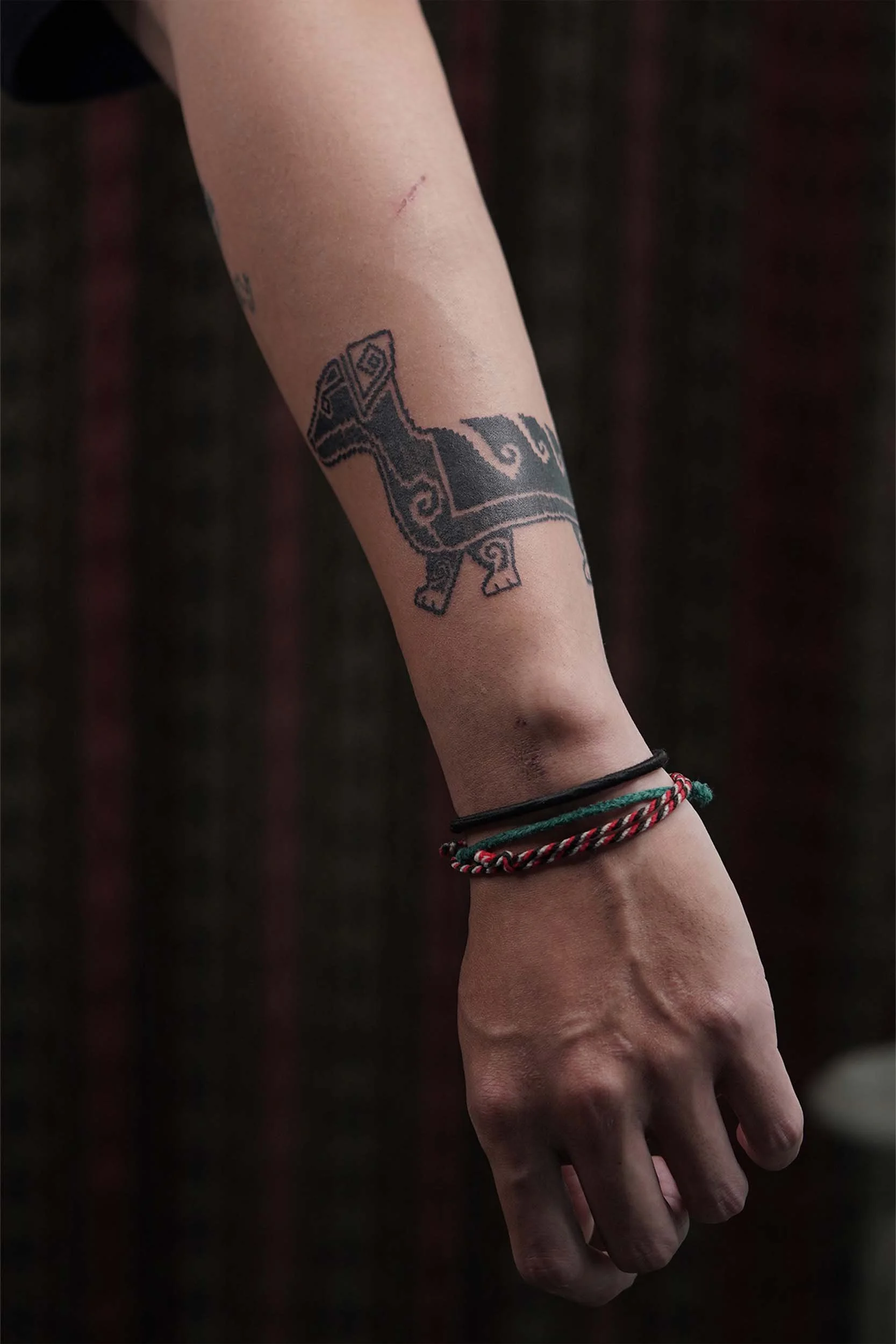 dog tattoo on the paw detail
