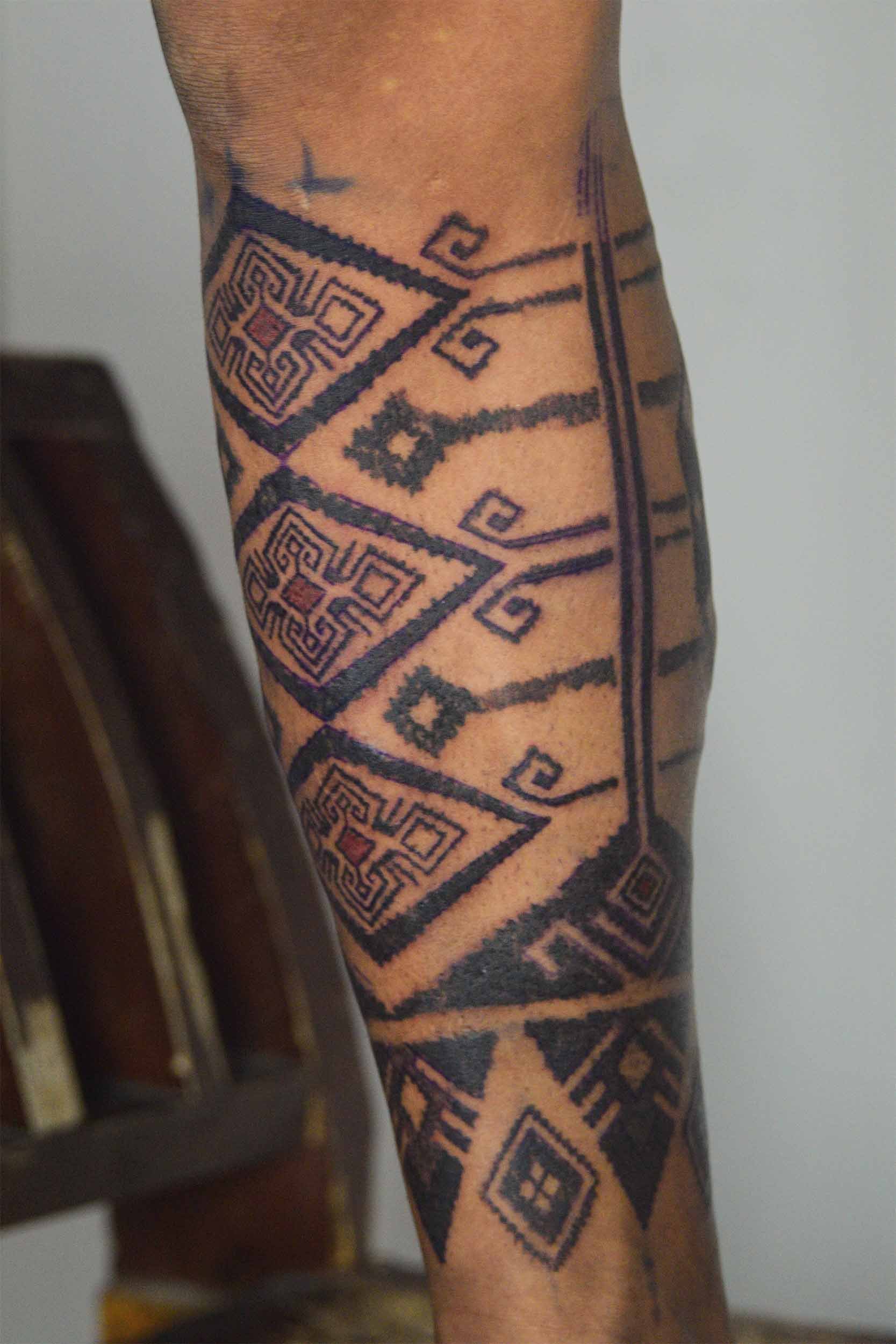 elegant lower leg sleeves ornamental style tattoo near kuta area