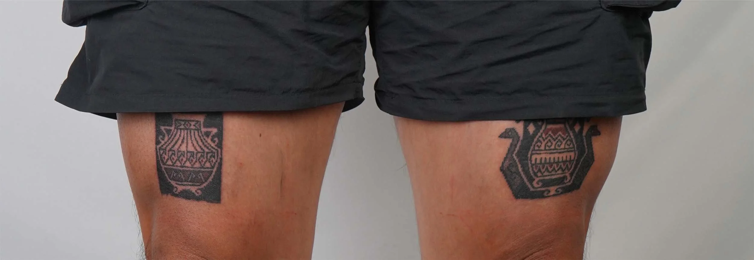 ornament vases tattoo on thigh