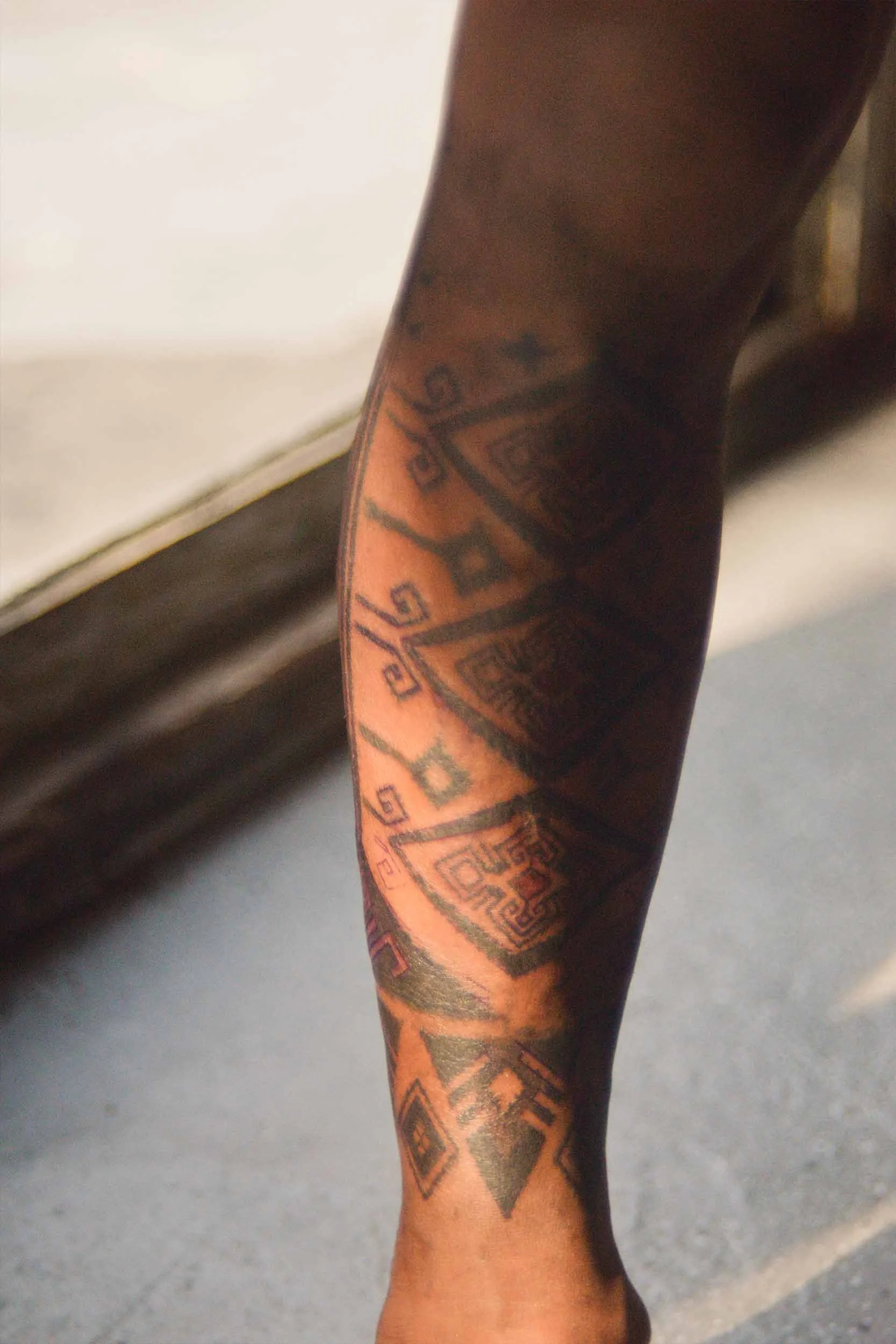 lower leg sleeves ornament piece ink by bali based tattoo artist with a distinct character