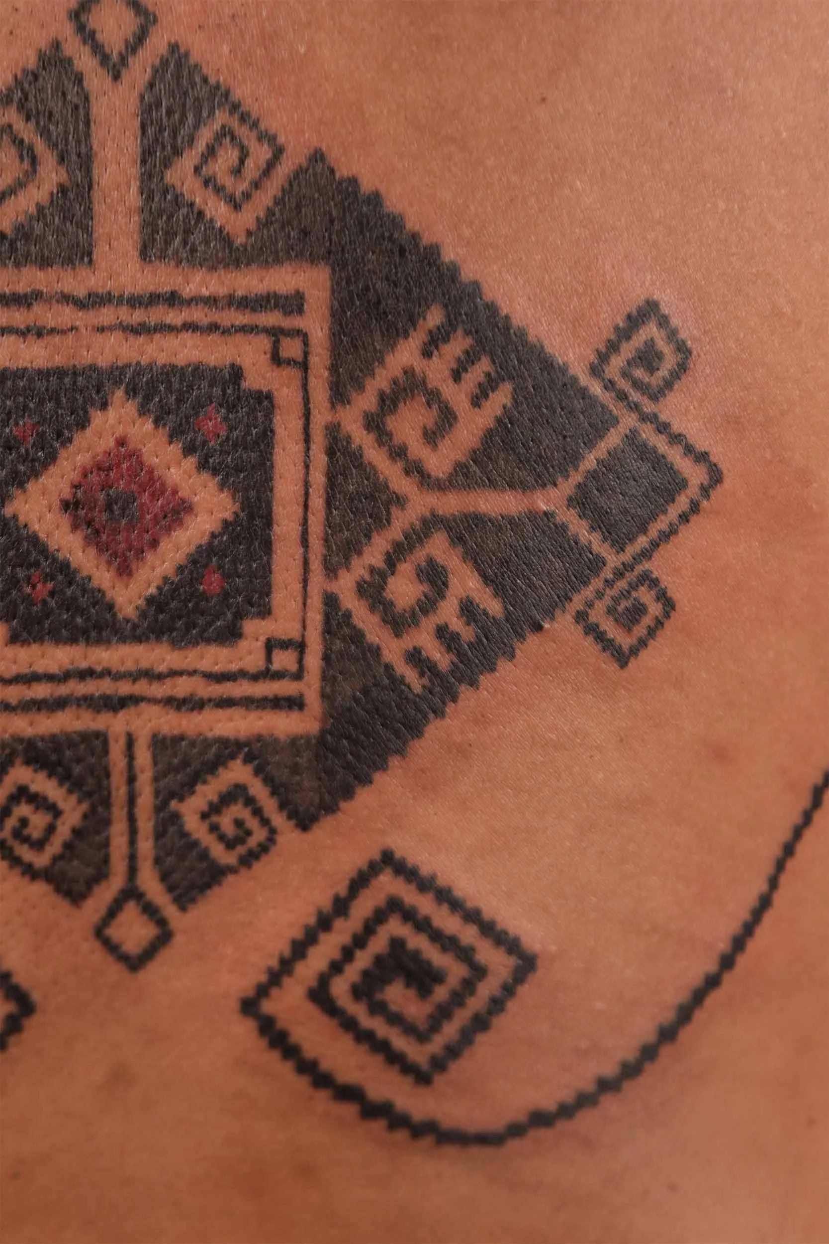 man spine ornamental tattoo