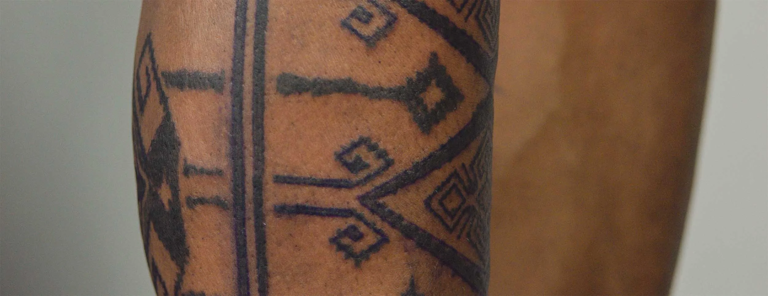 bold ornament piece on man lower leg done in near canggu tattoo studio