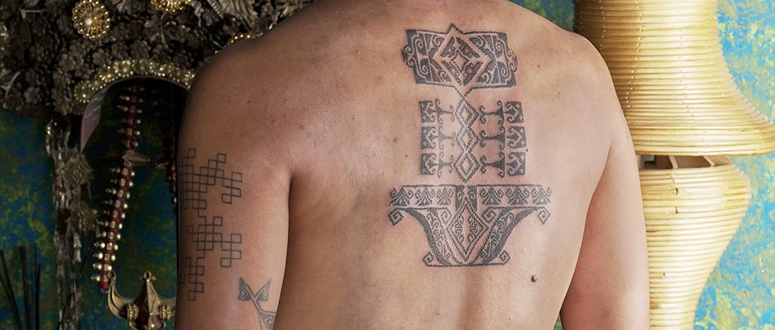 sunflower interpreted into a unique ornamental style with tenun texture on man back