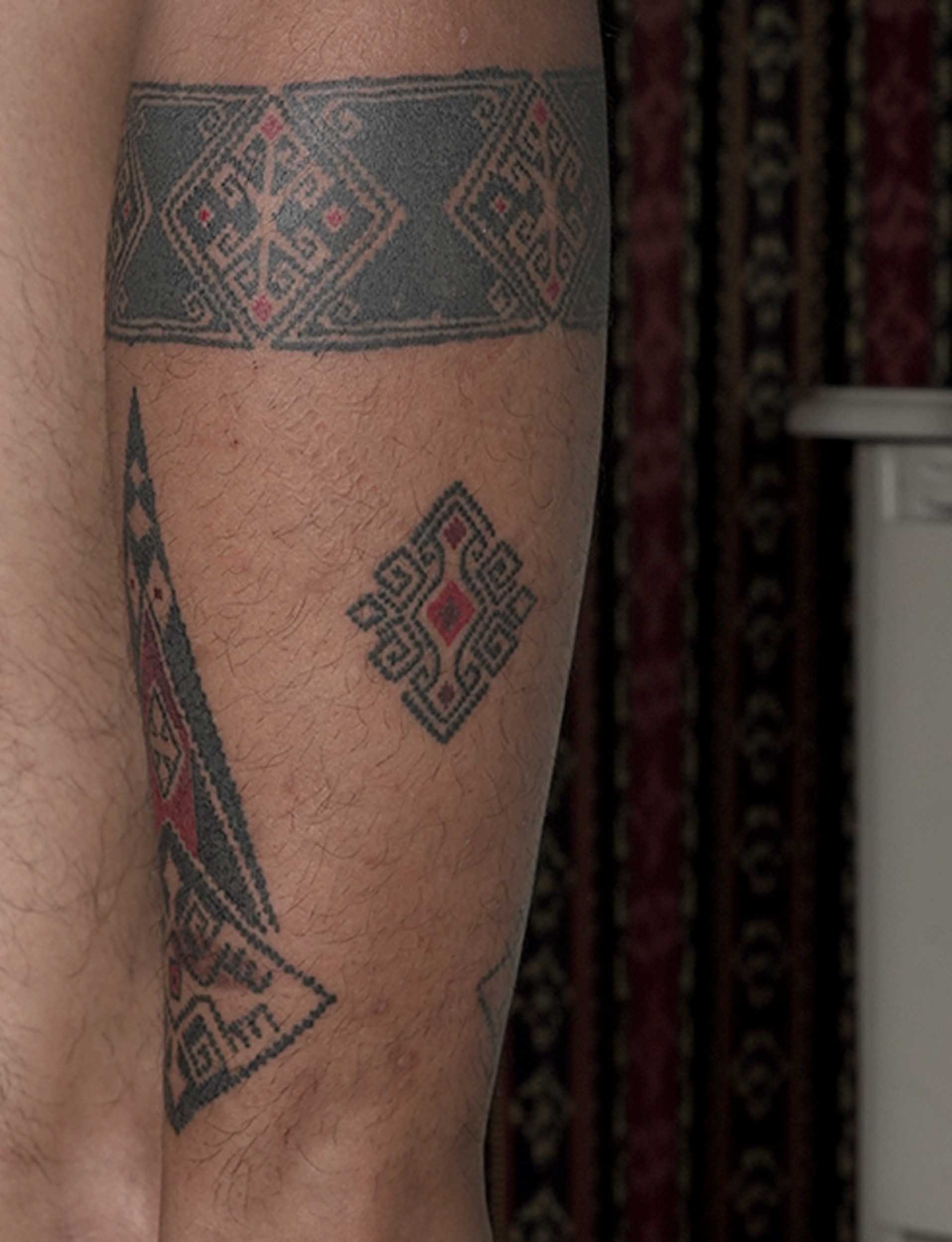 leg band tattoo in ornamental style by bali based tattoo artist
