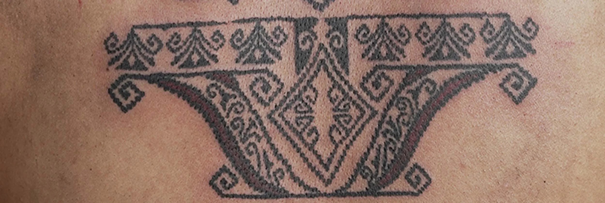 ornamental tattoo design inspired by tenun motif with close up shot