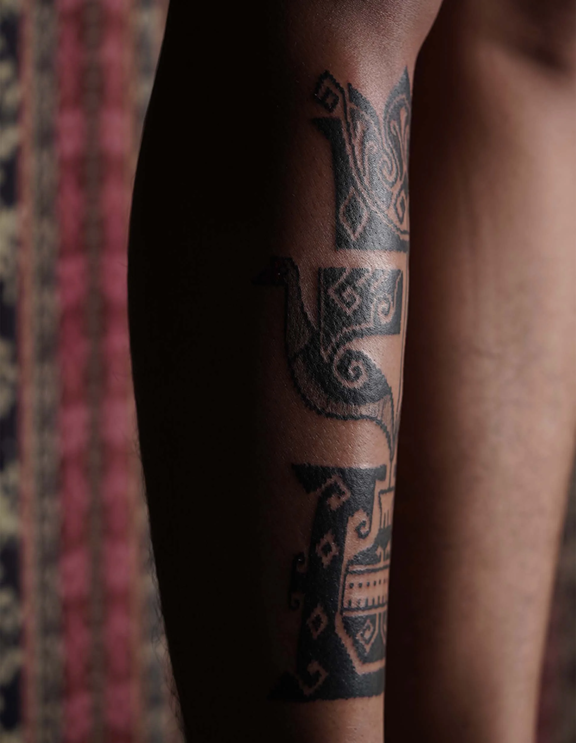 floral tattoo with black work ornament style on shin bone