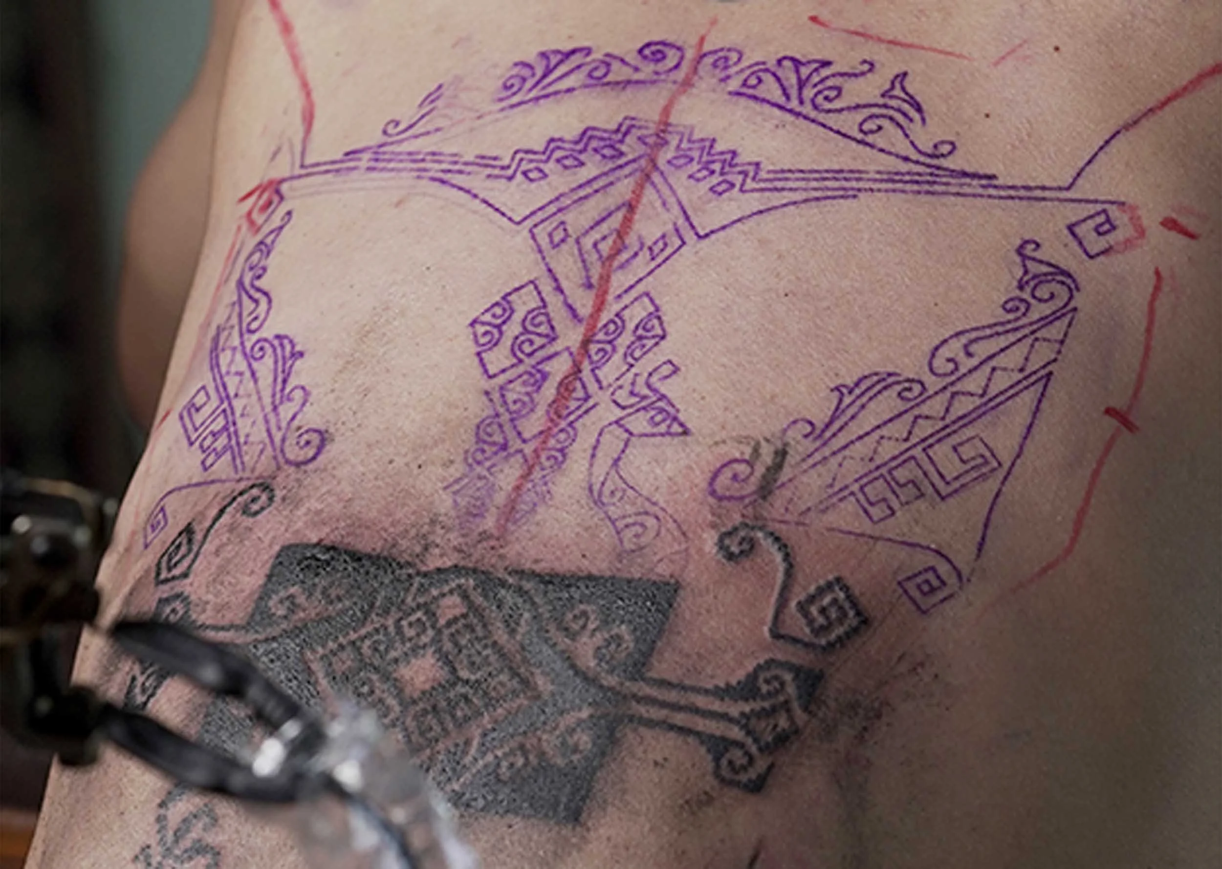 bold ornamental black work tattoo by bali based tattoo artist in indonesia
