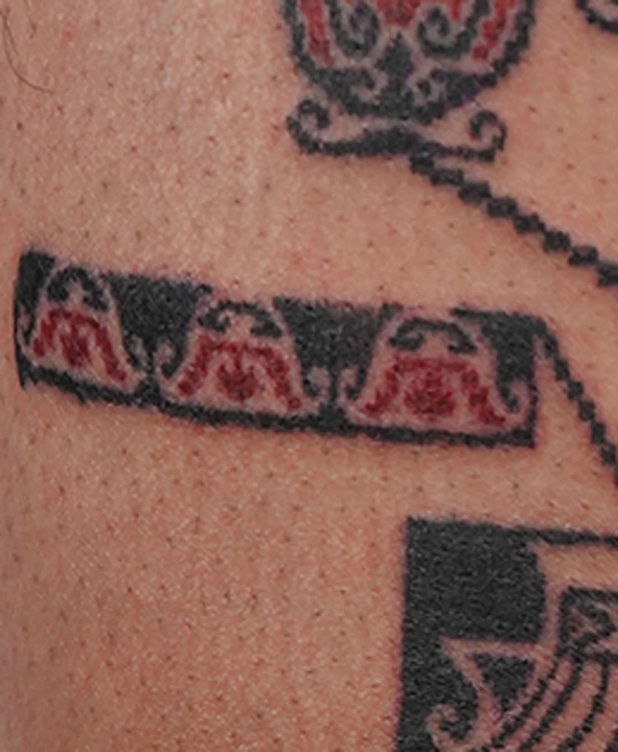 red flower tattoo