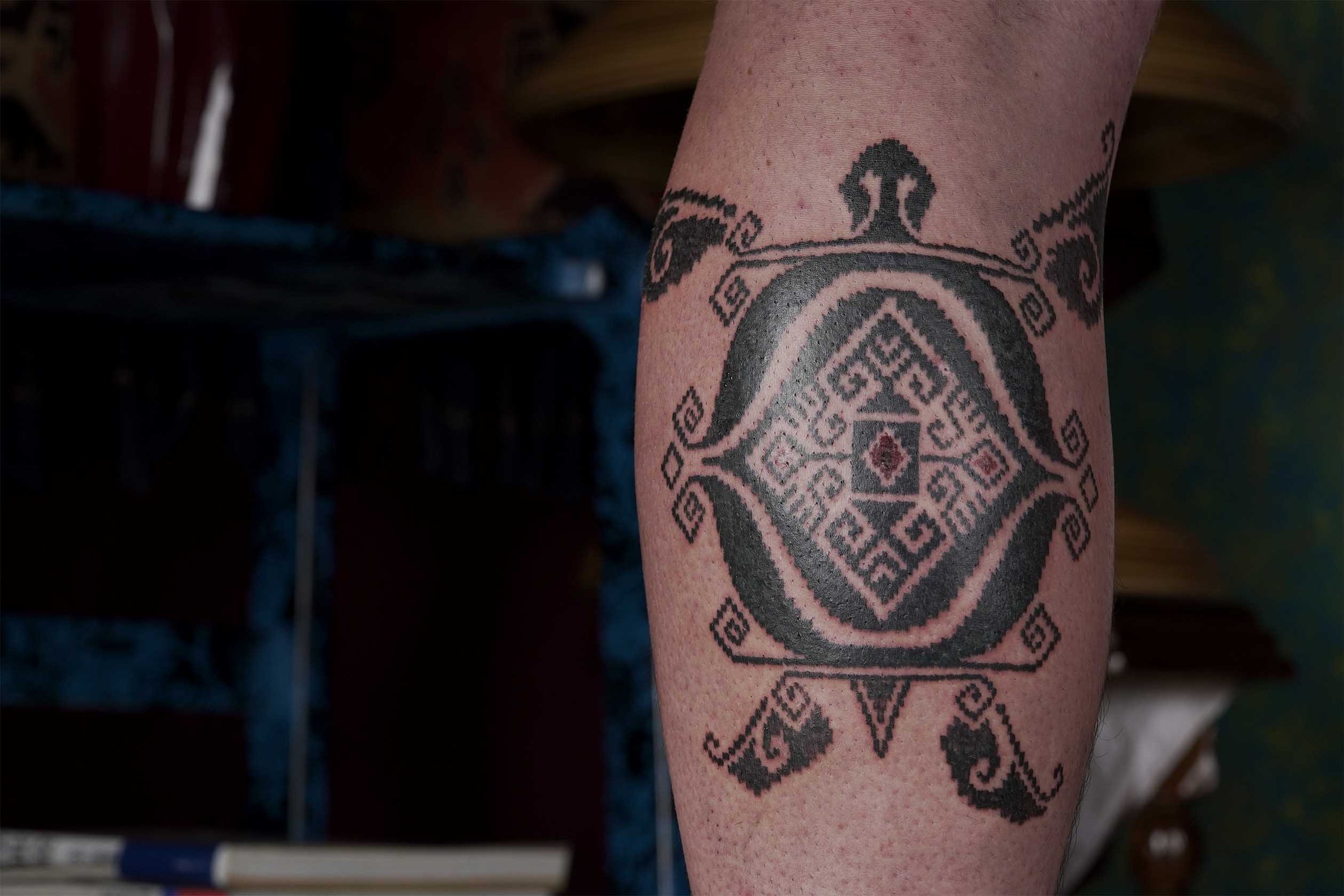 ornamental sea turtle tattoo with Nusantara pattern in Bali