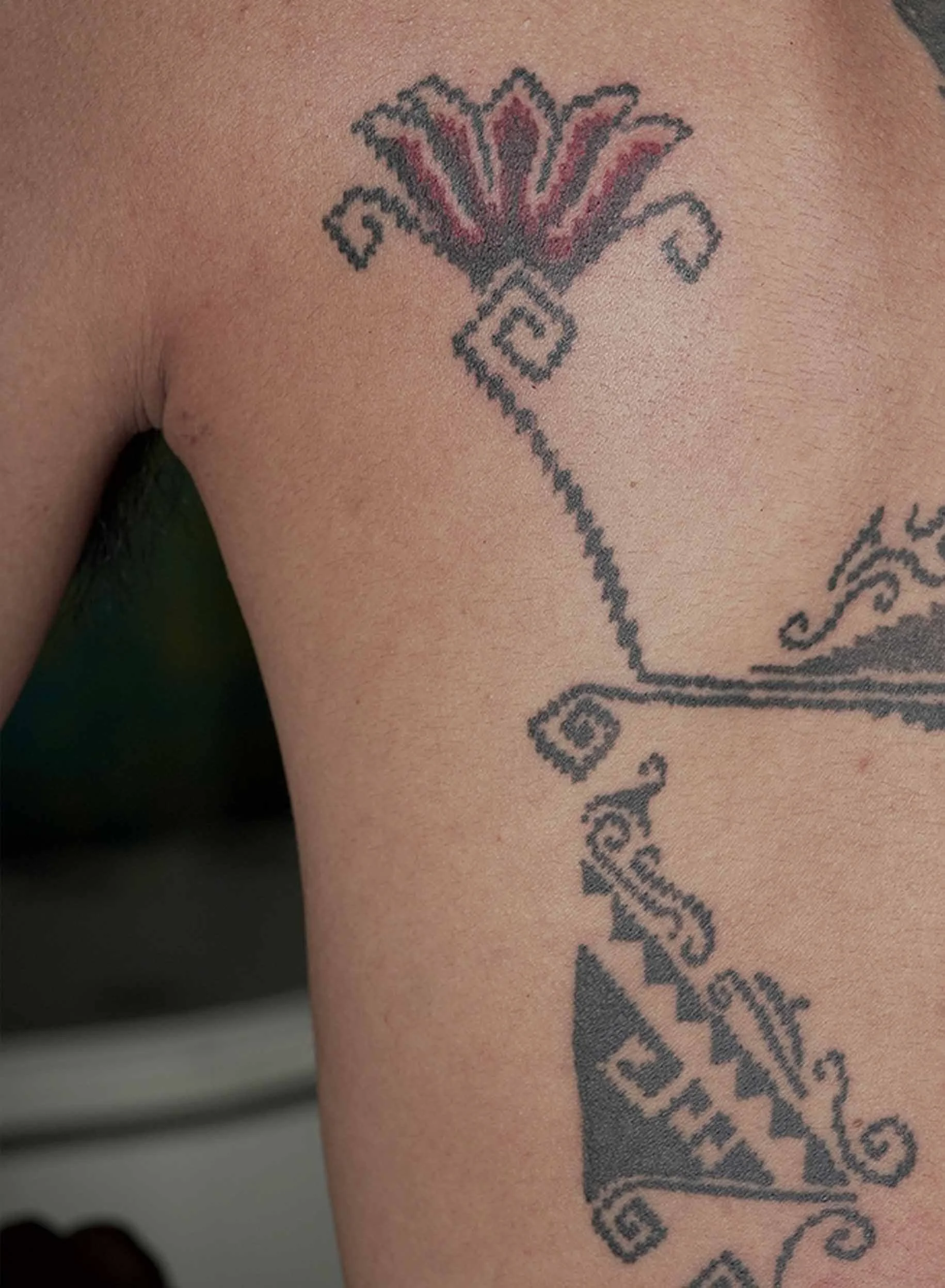 red tulip tattoo in simple ornamental style in bali