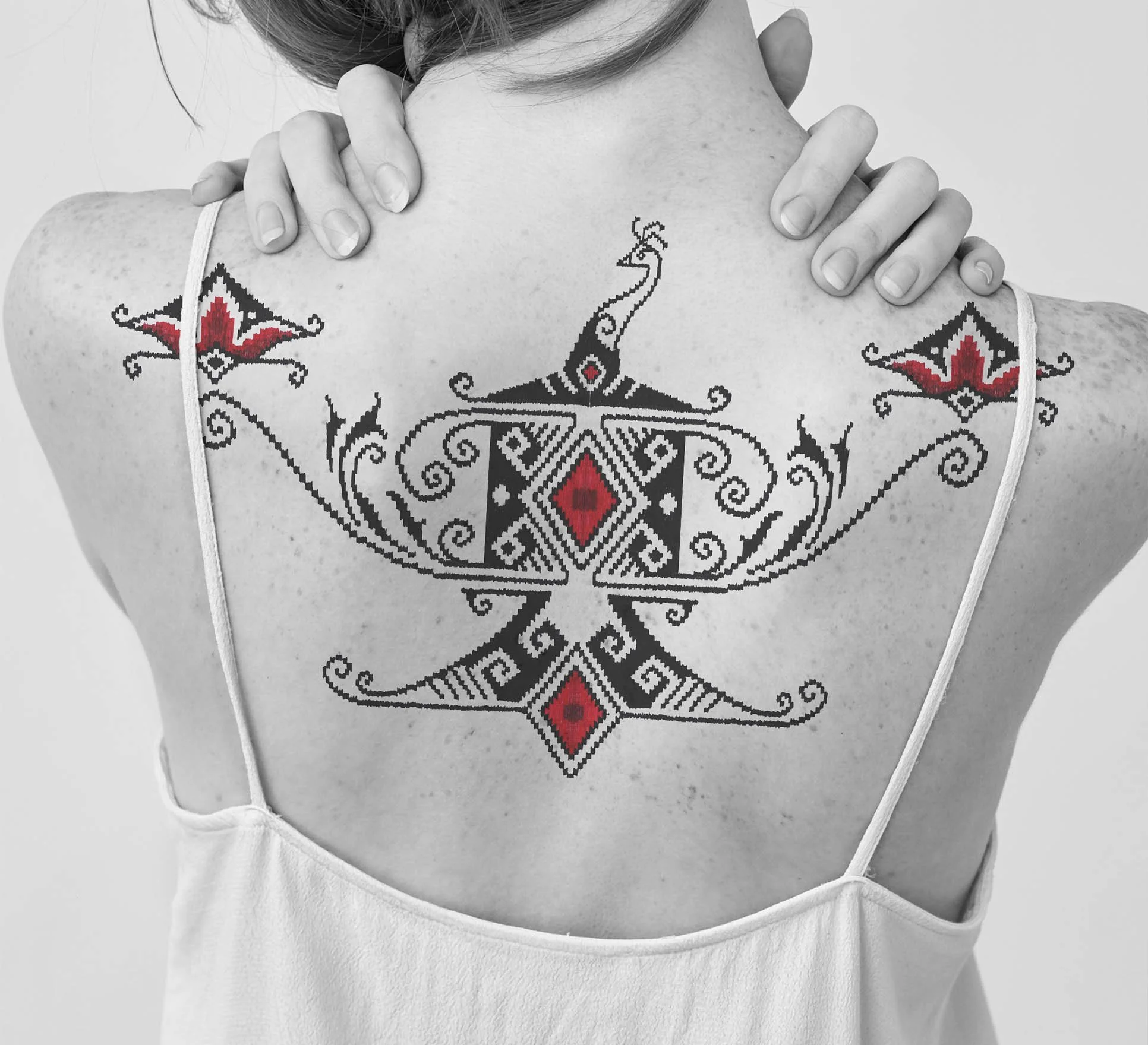 peacock in ornamental style with flower of tulip tattoo idea 