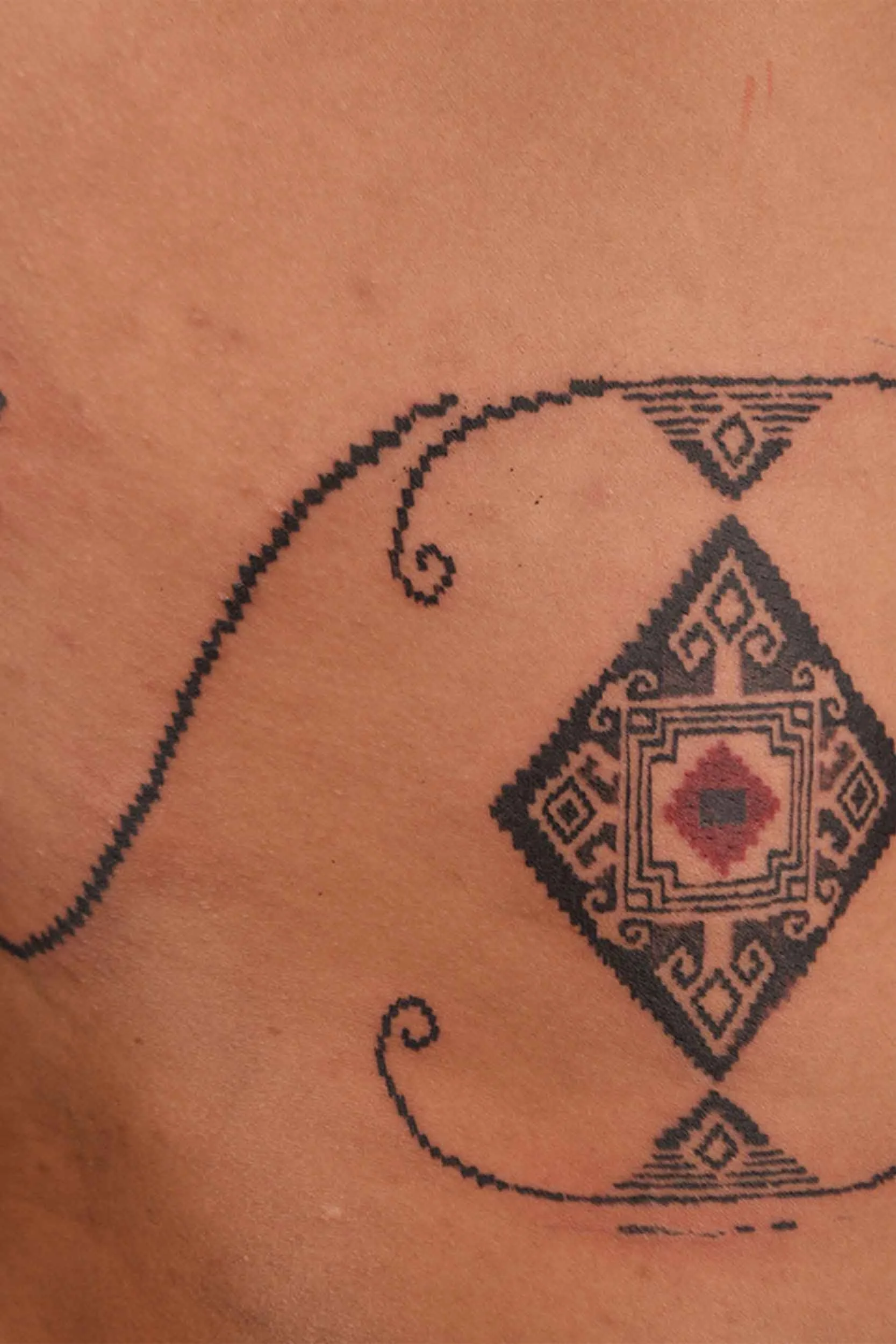 ribs ornament tattoo with unique tenun texture