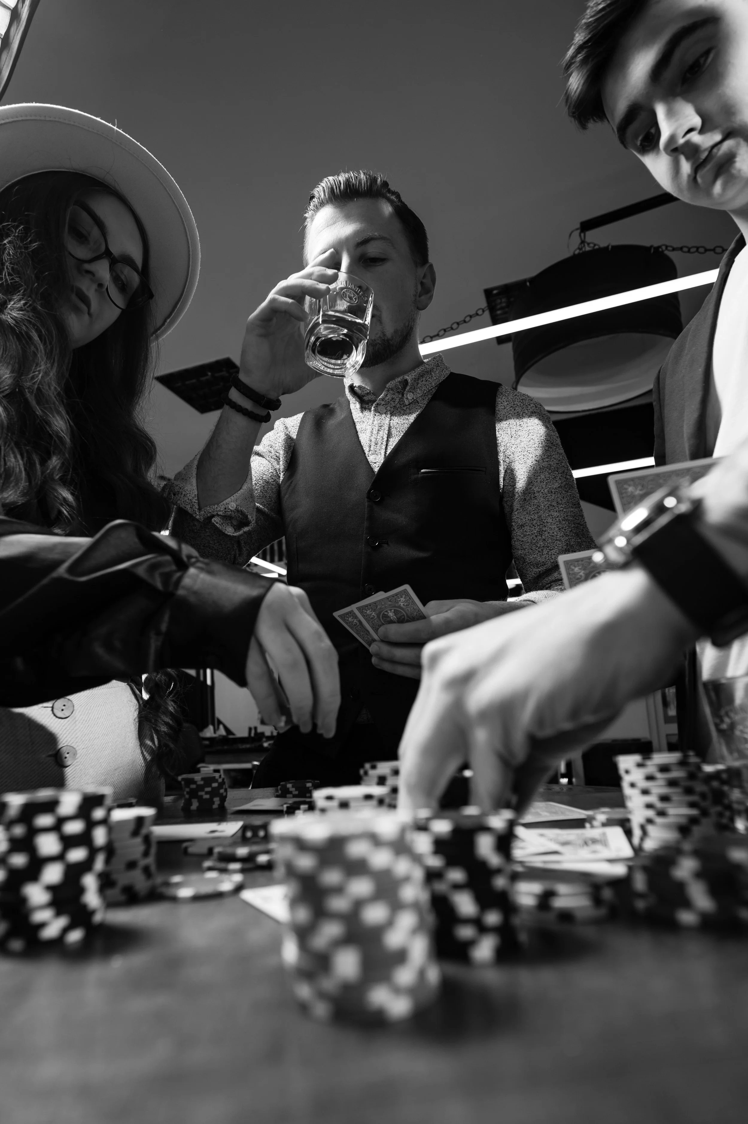 First-person observation of card poker from various close-up angles. a team of young boys and girls play poker. Blackjack