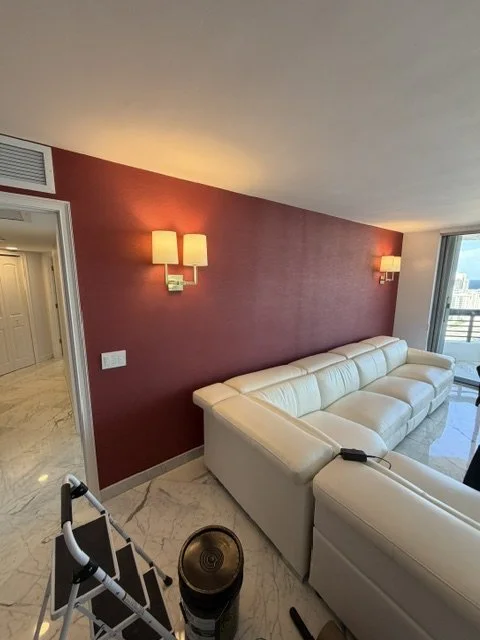 Rich red wallcovering installed in an elegant living room