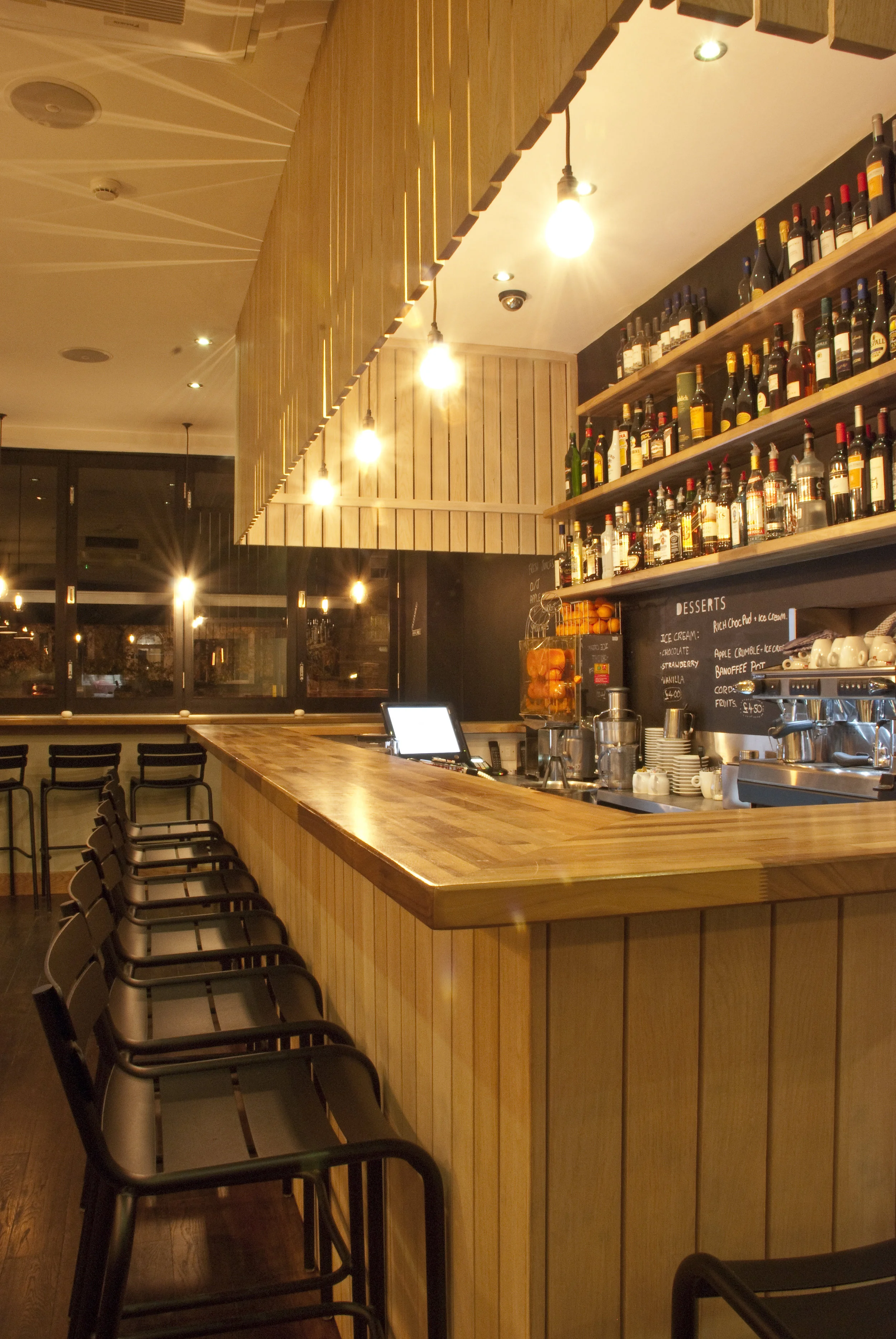 Timber bar interior at The Honest Italian pizza restaurant in Balham
