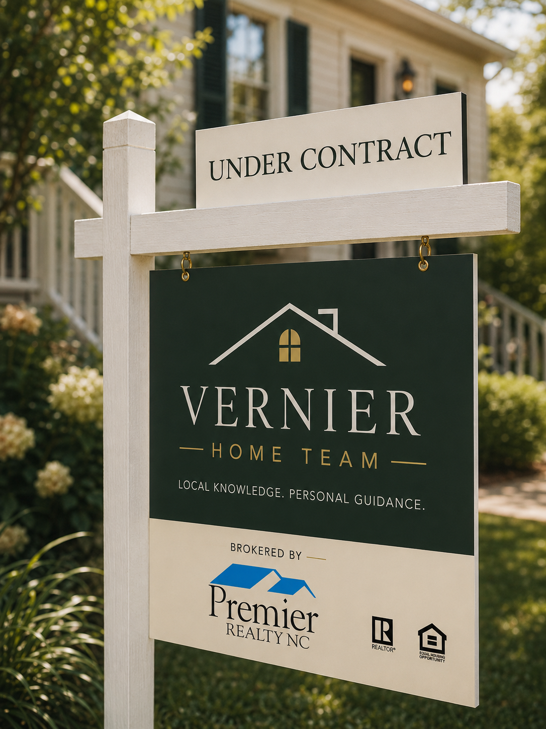 House for sale sign with 'Under Contract' in front yard, displaying real estate company details, house illustration, and greenery in background.