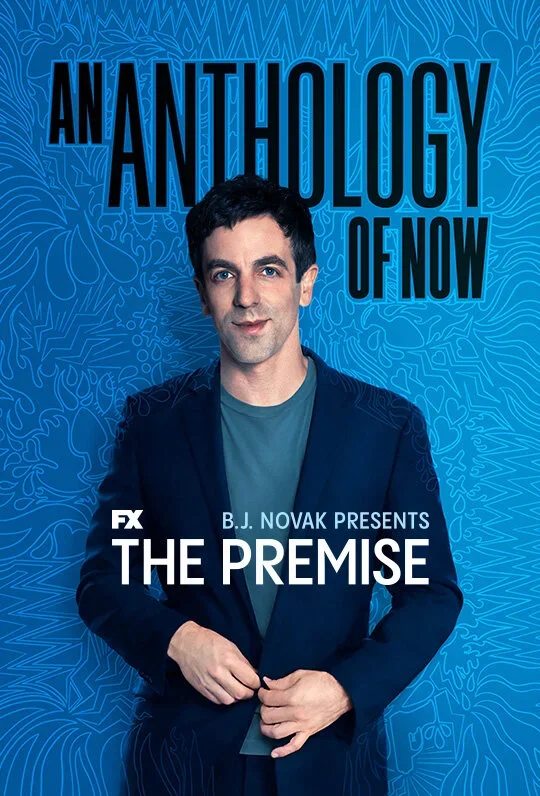 Promotional poster for the TV series 'The Premise' featuring a man with dark hair in a navy blazer and teal shirt, standing against a blue patterned background with the title 'An Anthology of Now' at the top.