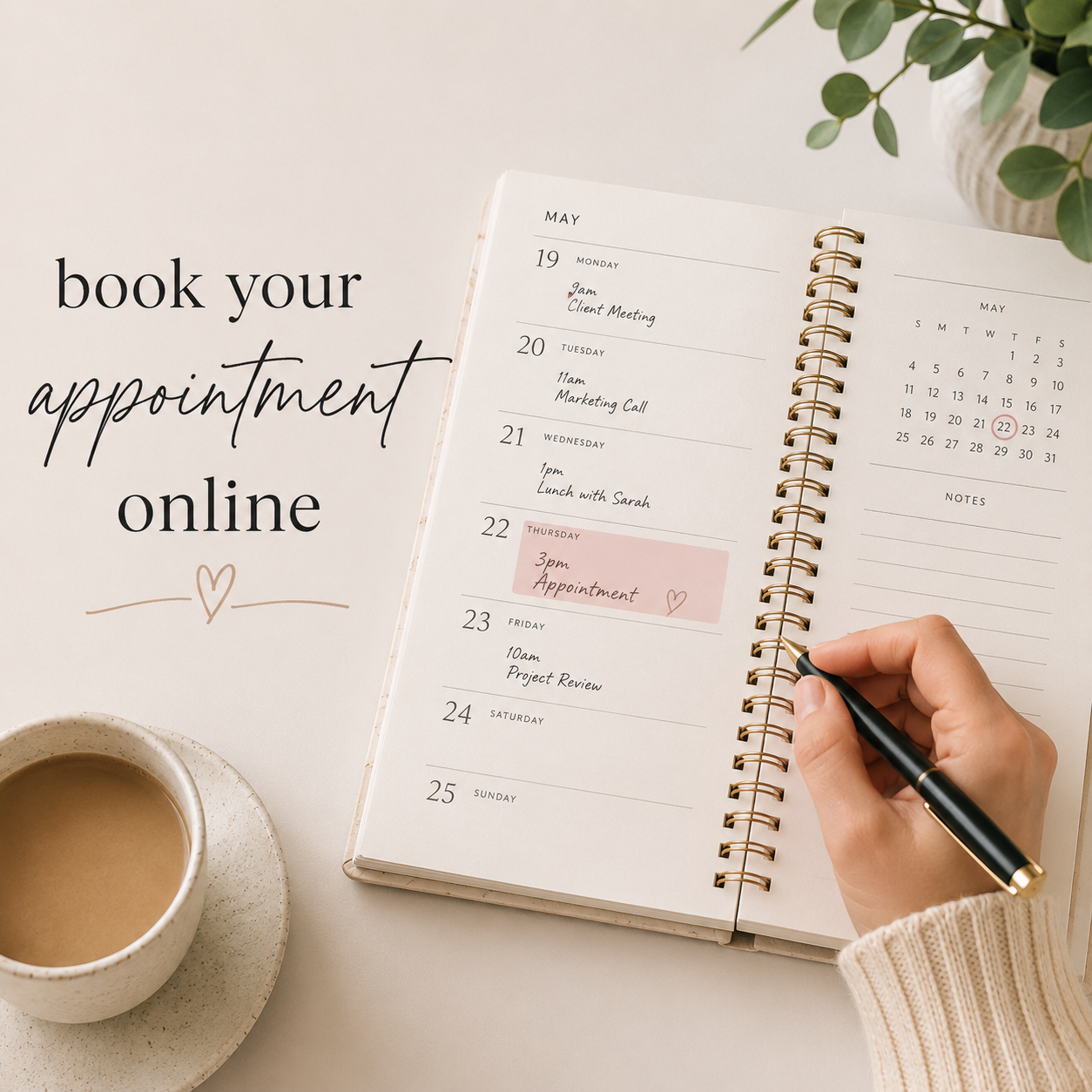 Open planner with scheduled appointments and a person writing on it, with a cup of coffee nearby, and a plant in the background.