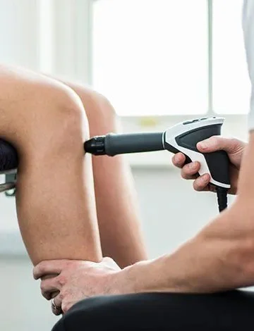 Person receiving dry needling therapy in their calf muscle.