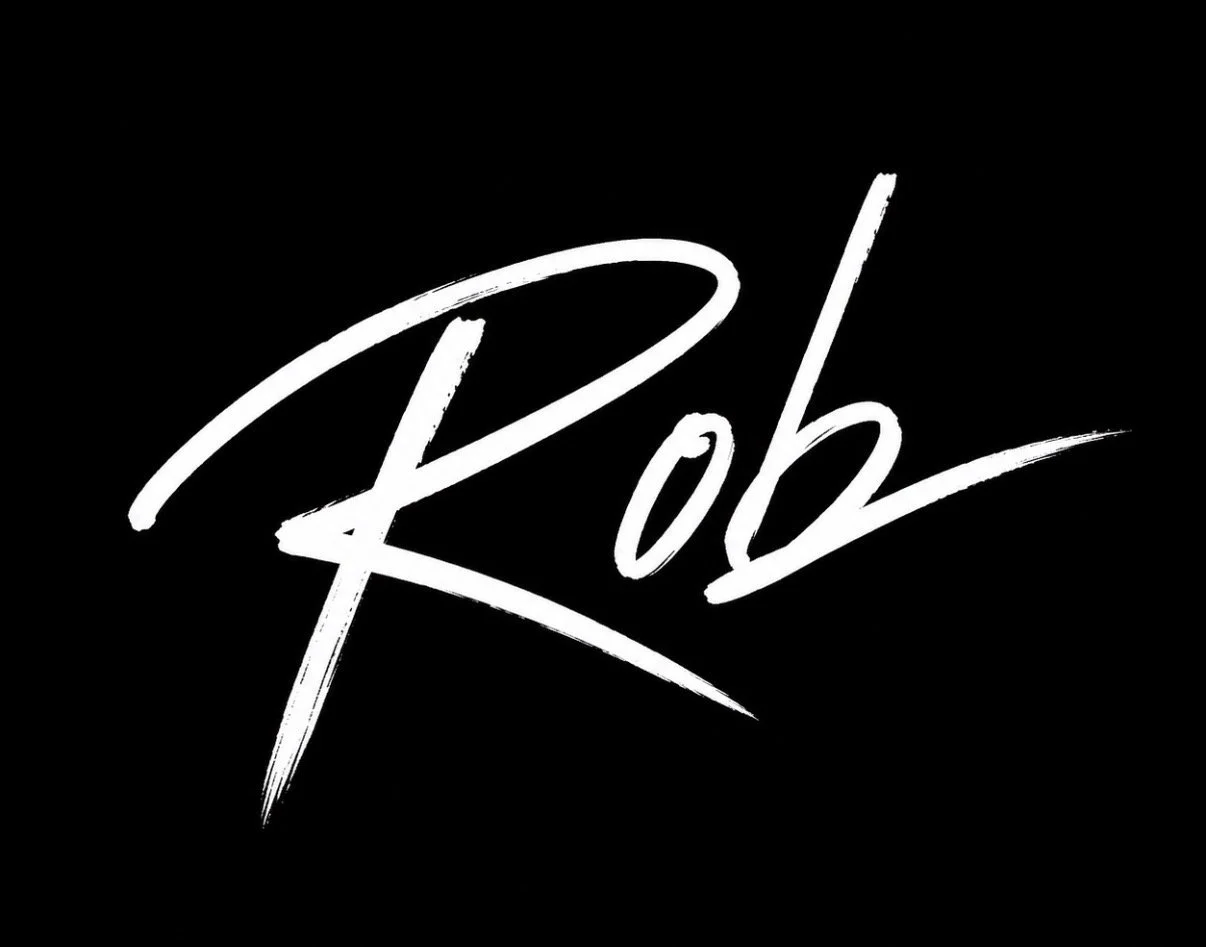 Stylized signature of the name "Rob" in white on a black background.