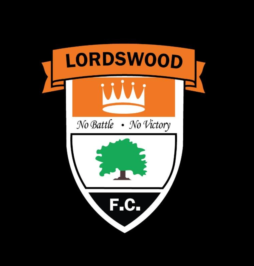 Lordswood Football Club crest featuring a crown, a green tree, and the motto "No Battle No Victory".