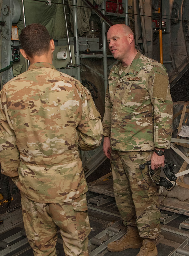 Military chaplain, Cody Hollist, talking with a service member and offering guidance and support.