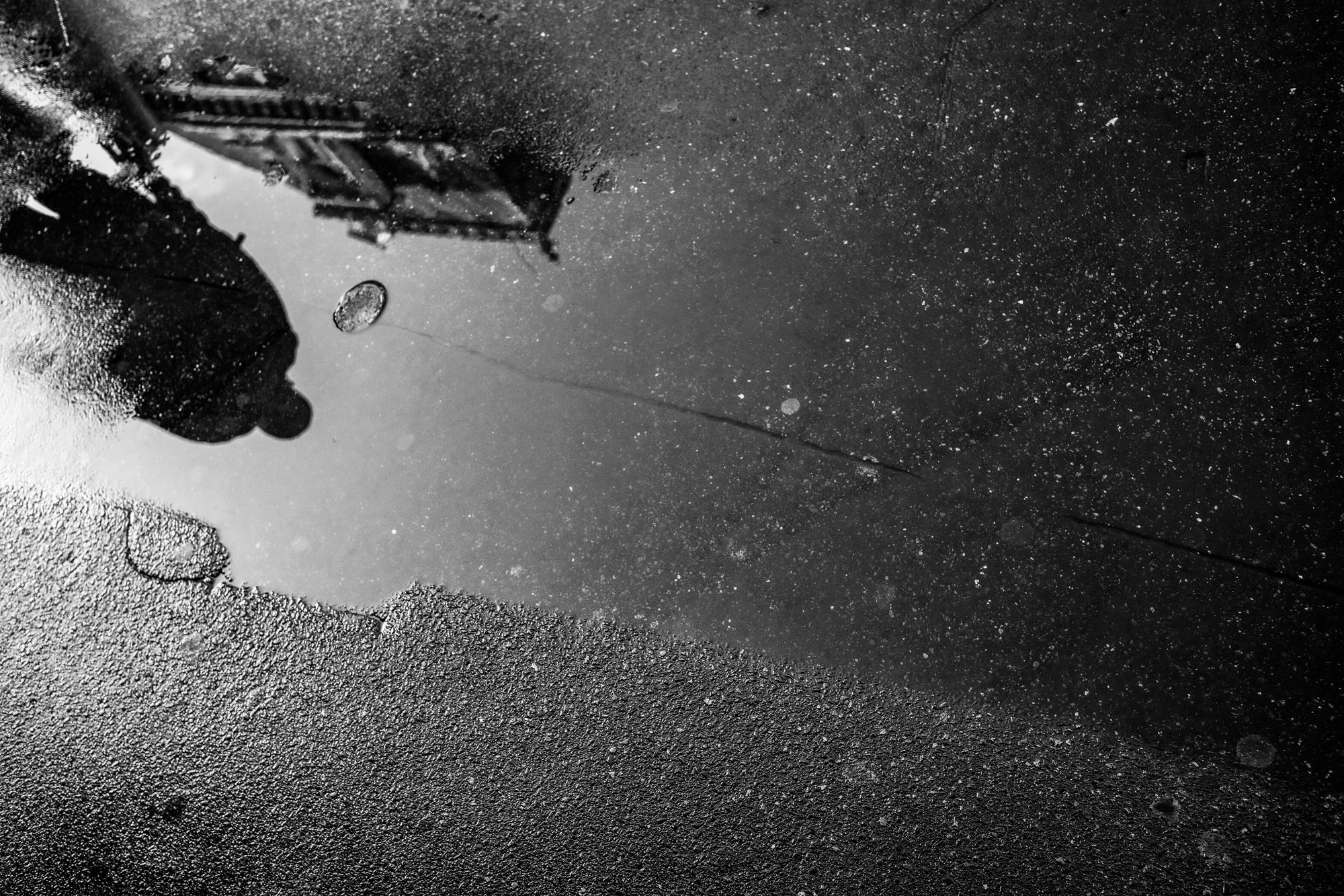 B&W Puddle w Man Reflection.jpg