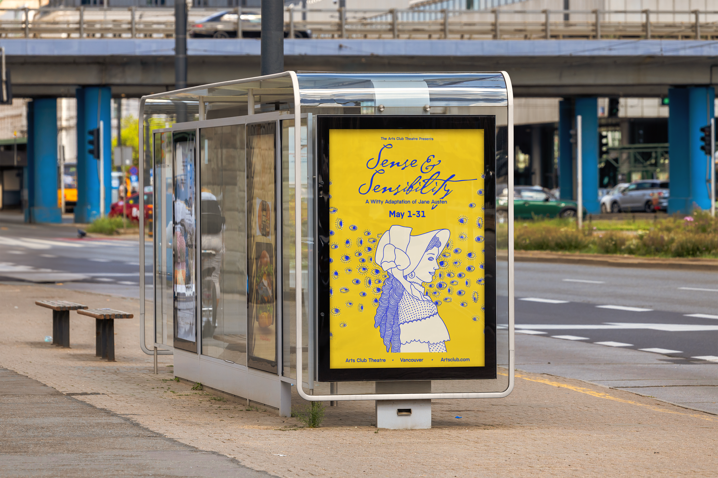 A bus stop shelter with a yellow poster advertising a show called "Sense & Sensibility" at the Arts Club Theatre in Vancouver, running from May 1 to May 31. The shelter is on a city street near an overpass with several cars driving above, and there is a bench nearby.