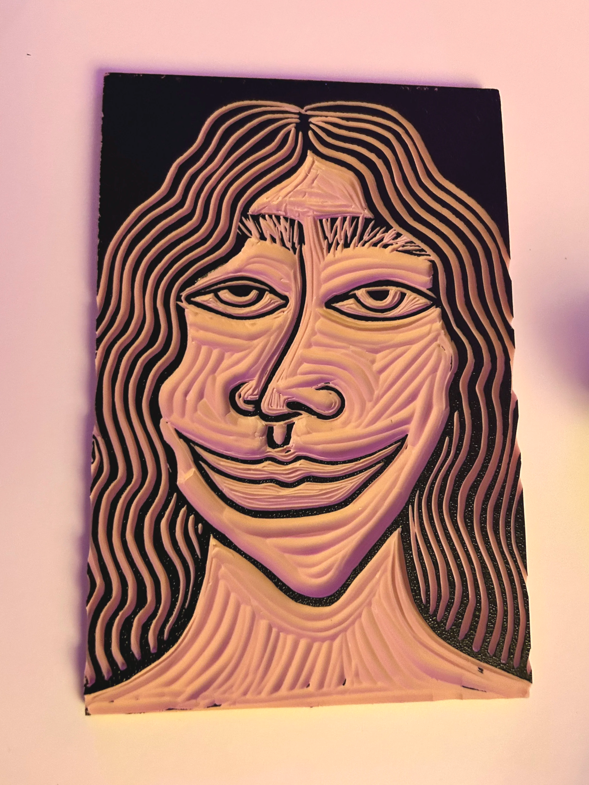 Painting of a woman's face created with thick textured brushstrokes, featuring long wavy hair, eyes, nose, and lips, on a black background.