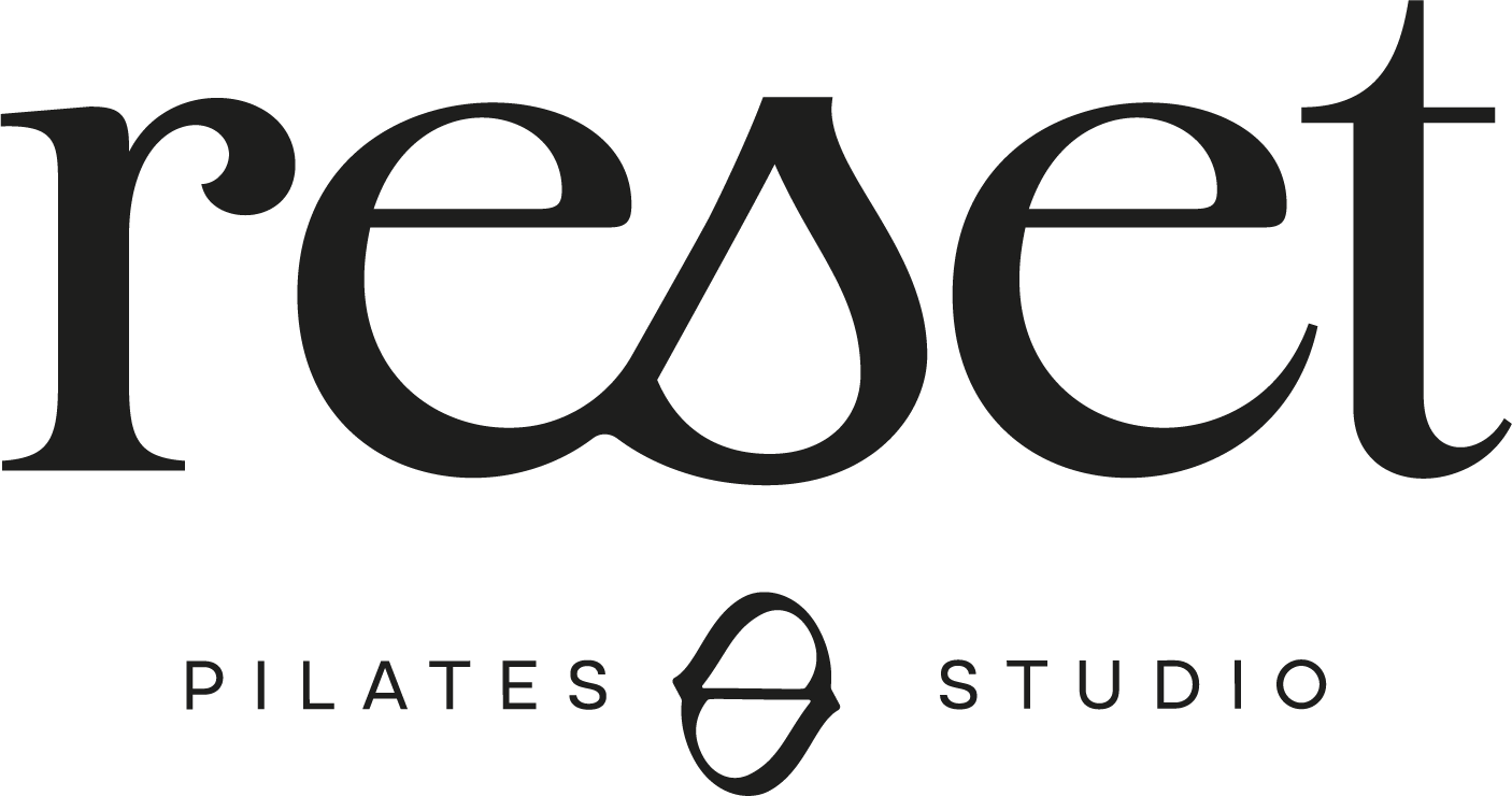 The logo for 'Reset Pilates Studio' with the word 'reset' in large black letters, and 'Pilates Studio' written underneath with a small icon of a Pilates reformer machine.